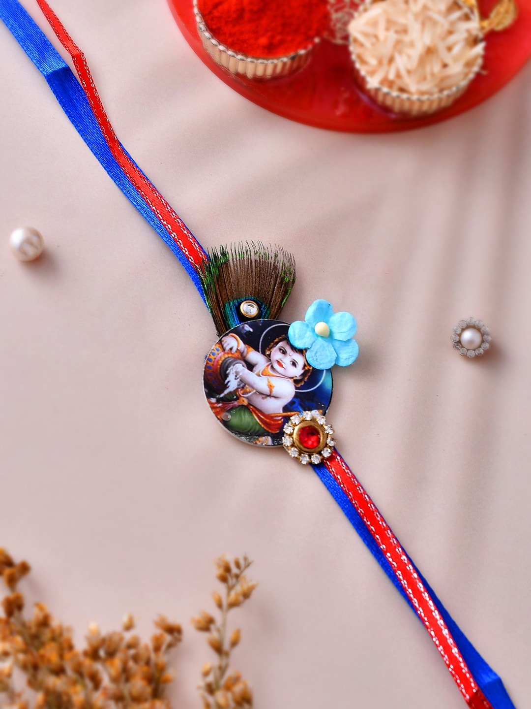 

Aapno Rajasthan Mor Pankh & Bal Gopal Divine Thread Rakhi, Blue