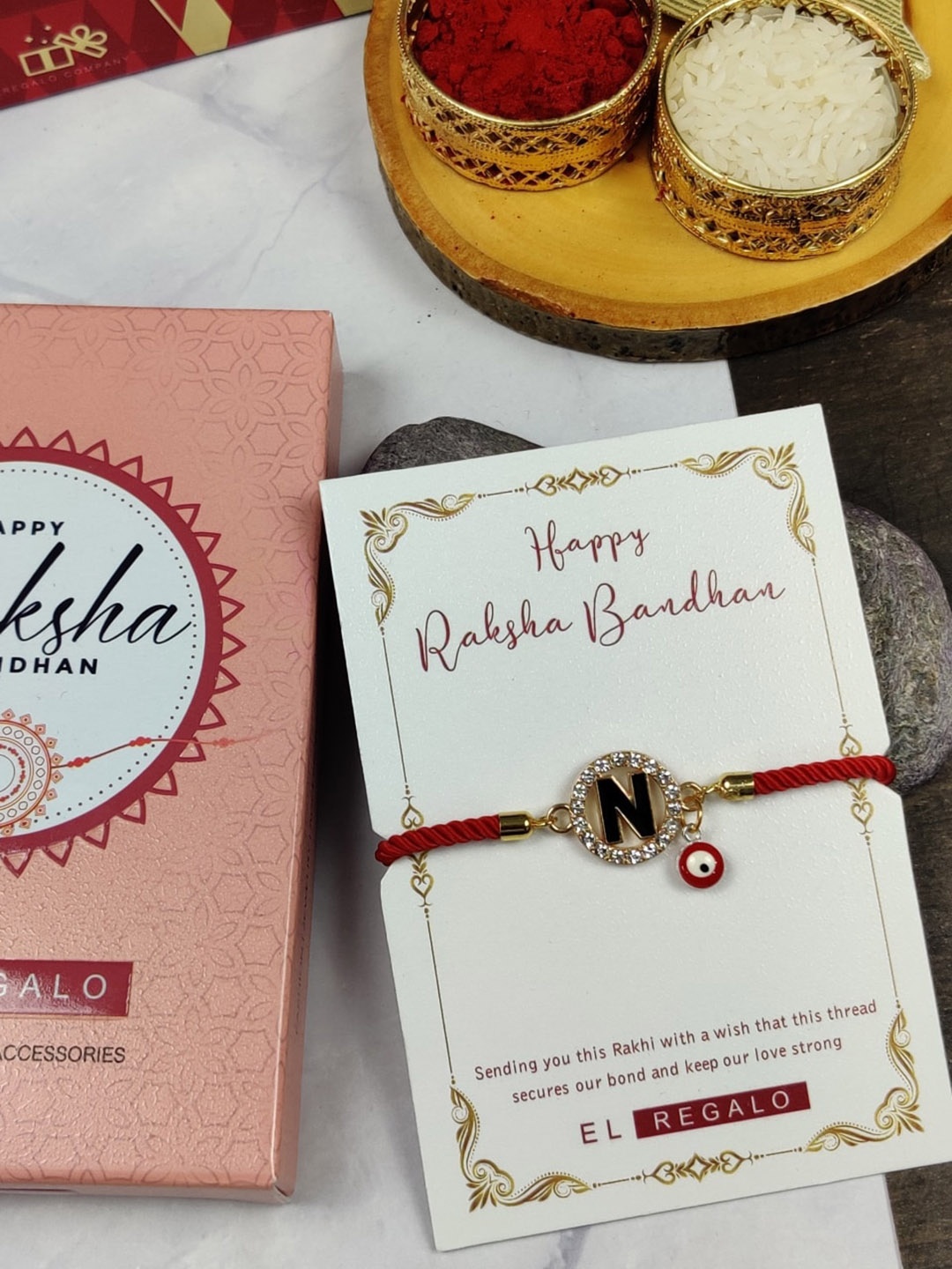 

EL REGALO Unisex D Name Initial Evil Eye Rakhi With Roli chawal Card, Red