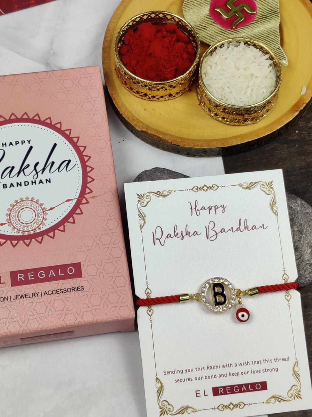 

EL REGALO B Name Initial Evil Eye Rakhi With Roli chawal Card, Red