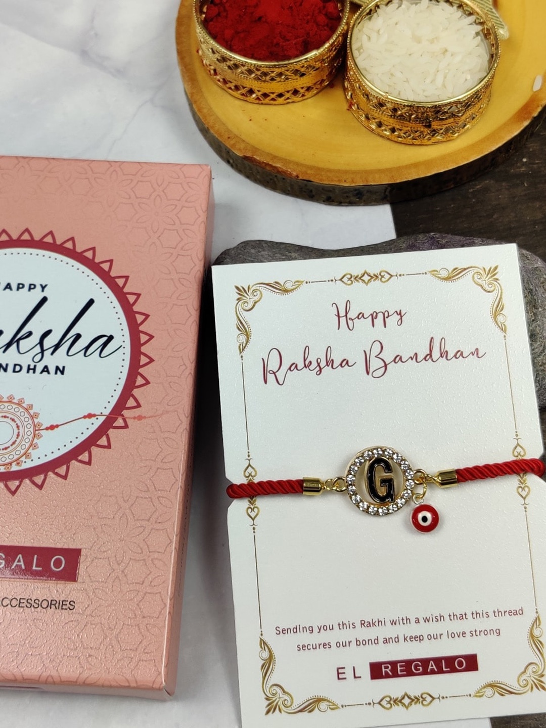 

EL REGALO Unisex G Name Initial Evil Eye Rakhi With Roli chawal Card, Red