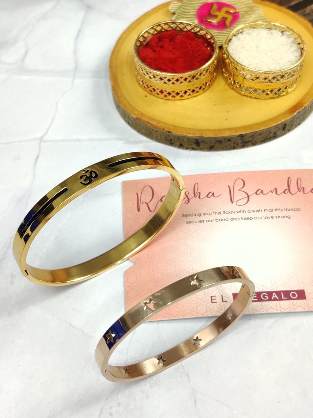 

EL REGALO Bhaiya Bhabhi Set Of 2 Kada Stainless Steel Rakhi With With Card Roli Chawal, Gold