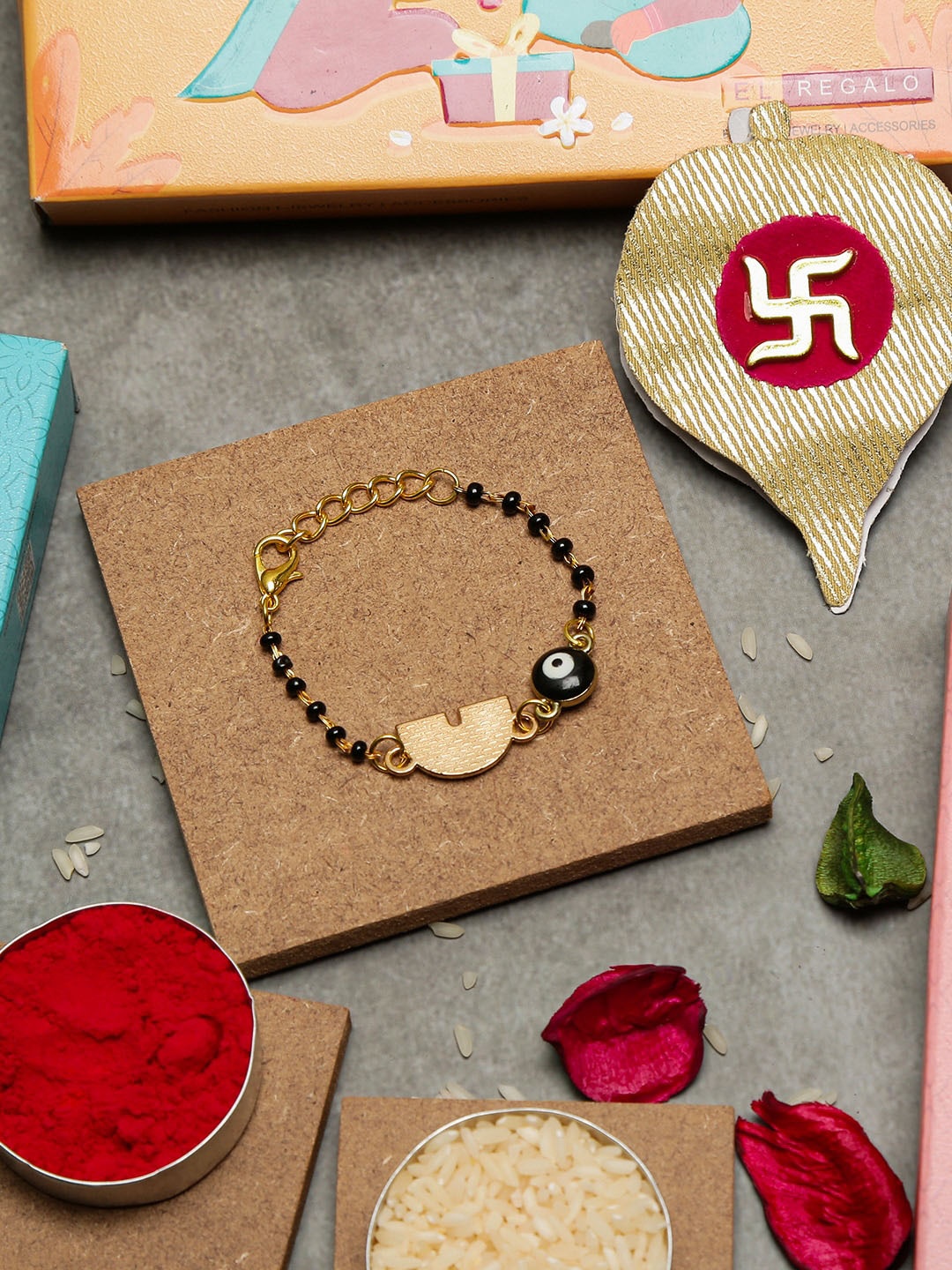 

EL REGALO Gold-Plated Stone-Studded Charm Rakhi With Roli & Chawal & Greeting Card