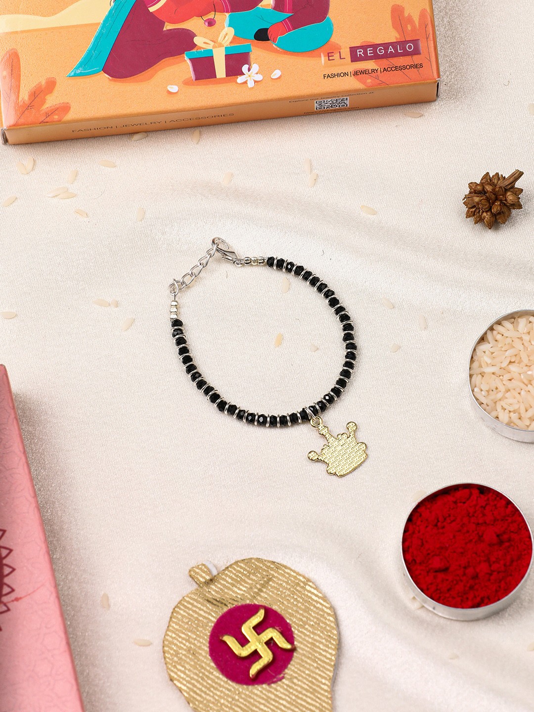 

EL REGALO Beaded Crown Shaped Charm bracelet Rakhi With Roli & Chawal & Card, Gold