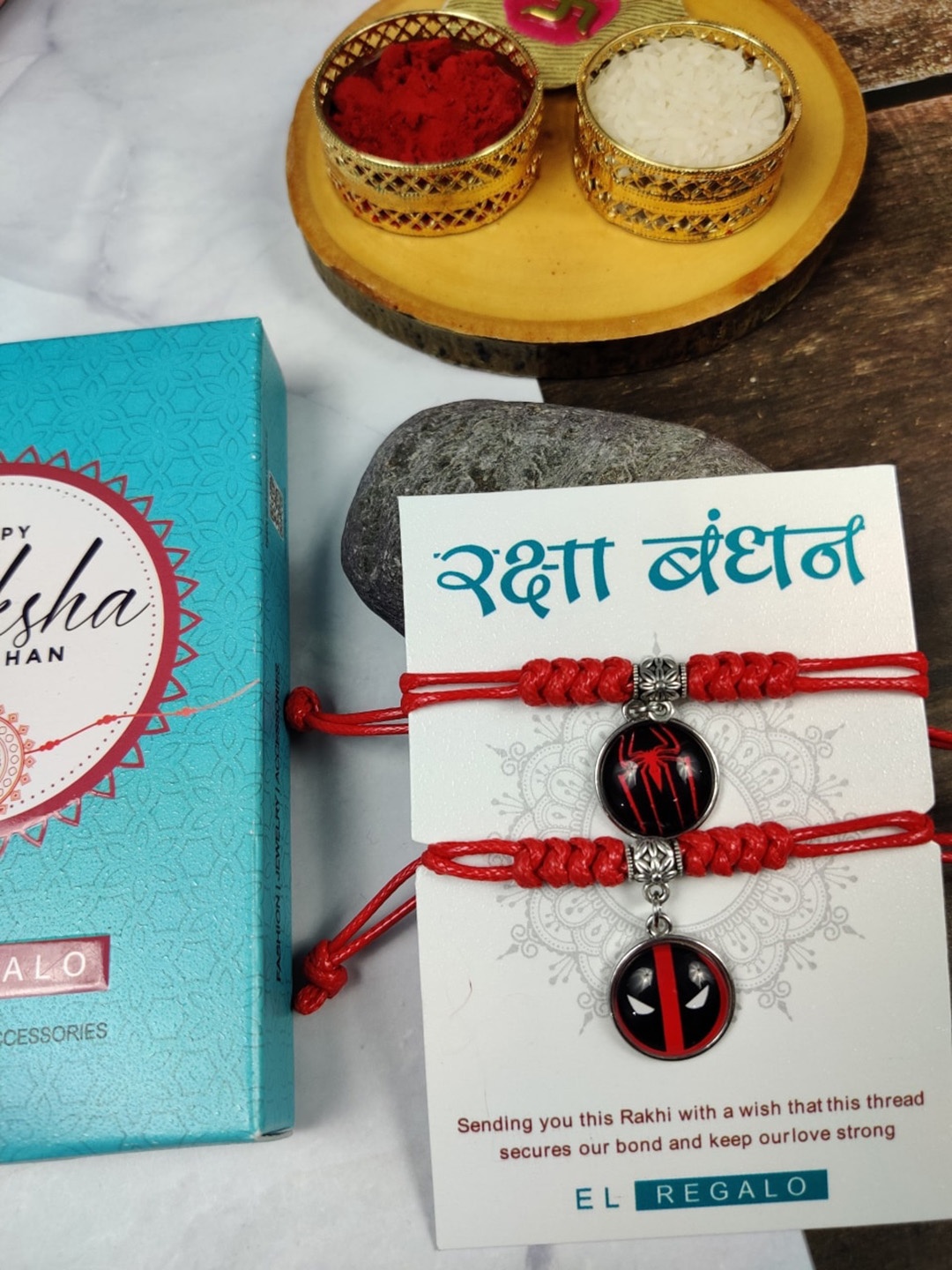 

EL REGALO Kids Set Of 2 Charm Detail Thread Rakhis With Roli & Chawal, Red