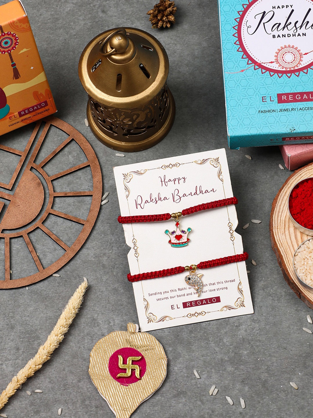 

EL REGALO Set Of 2 Charm Detail Rakhis With Roli & Chawal, Red