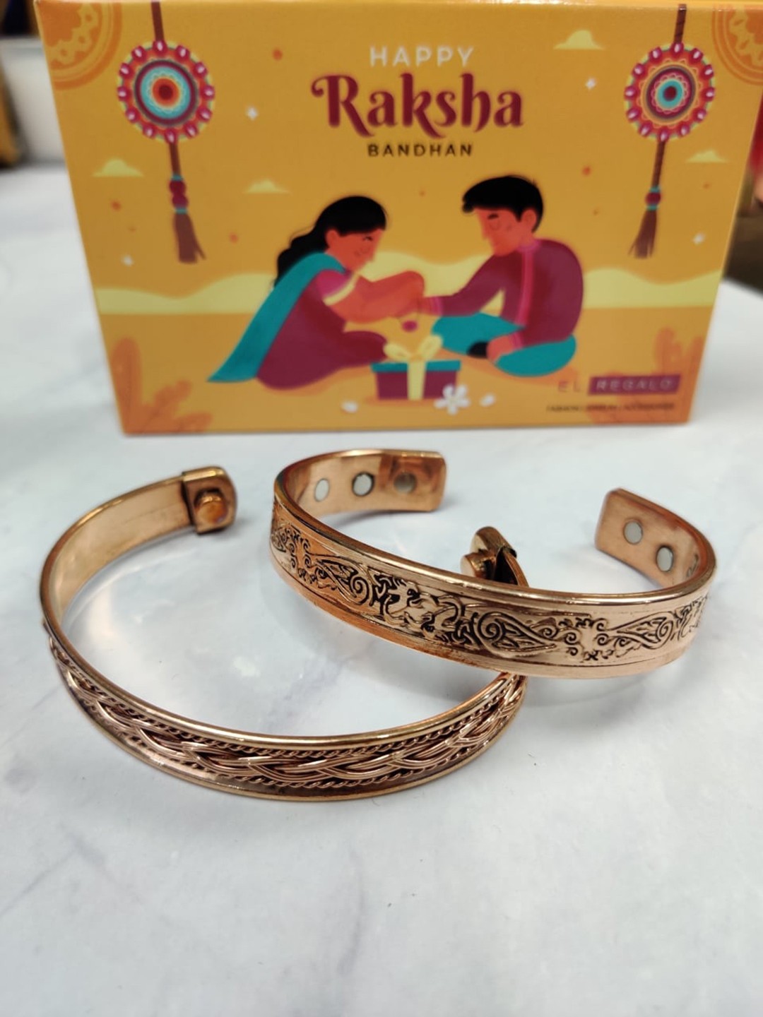 

EL REGALO Bhaiya Bhabhi Set Of 2 Kada Braclet Rakhi With Roli Chawal Card, Copper