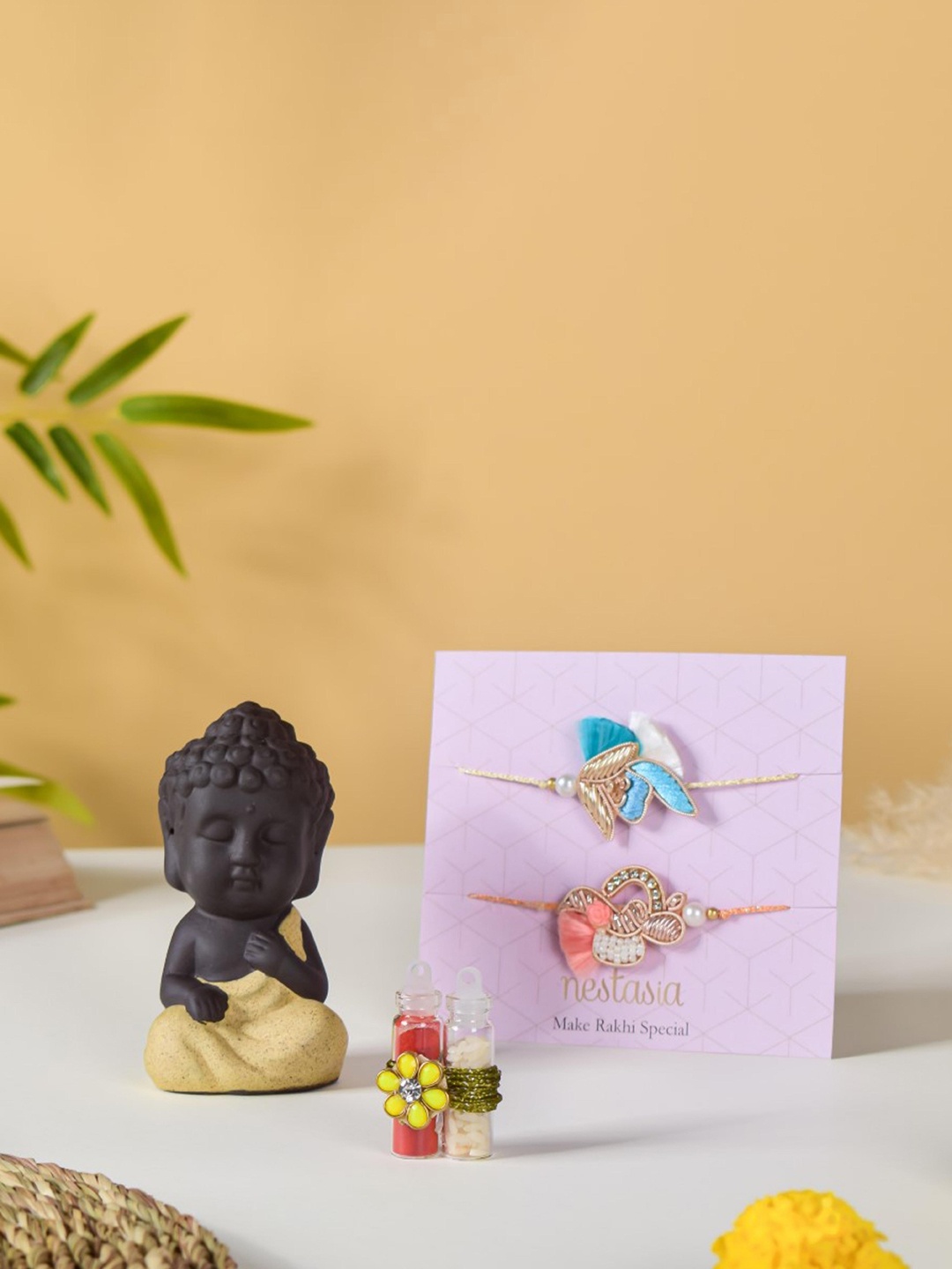 

Nestasia 2-Pcs Rakhi Gift Set With Showpiece & roli chawal, Peach