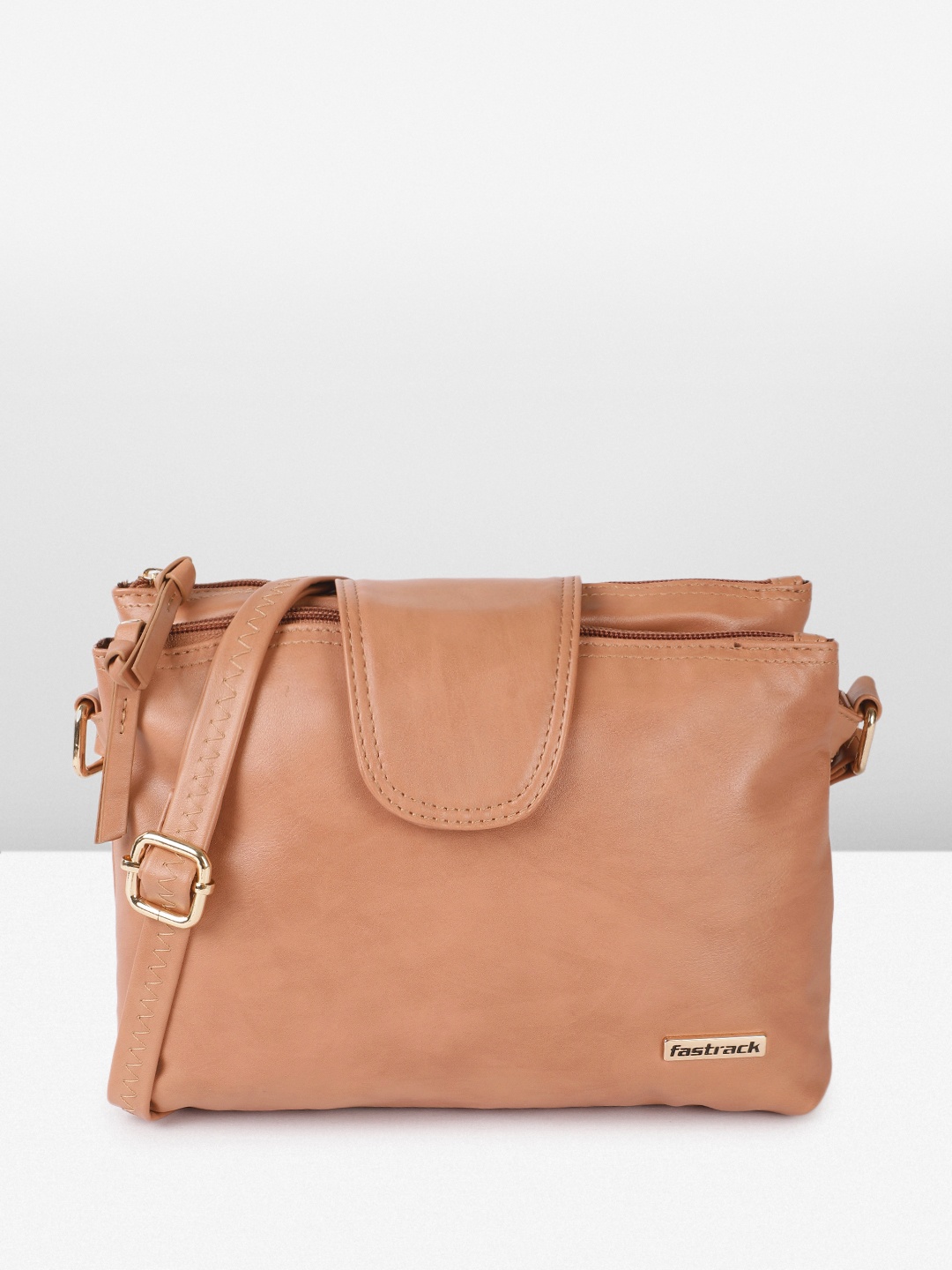 

Fastrack Women Structured Sling Bag with adjustable sling straps, Tan