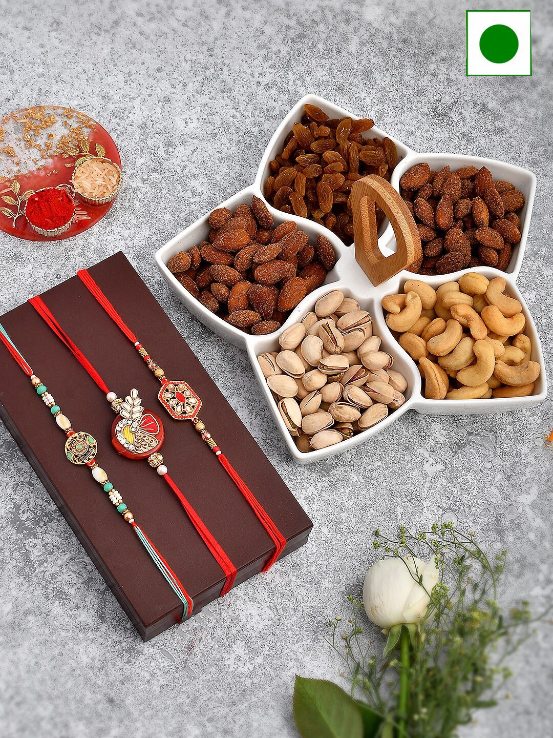 

Aapno Rajasthan Dryfruits and Serving Set With 3 Rakhis, Red