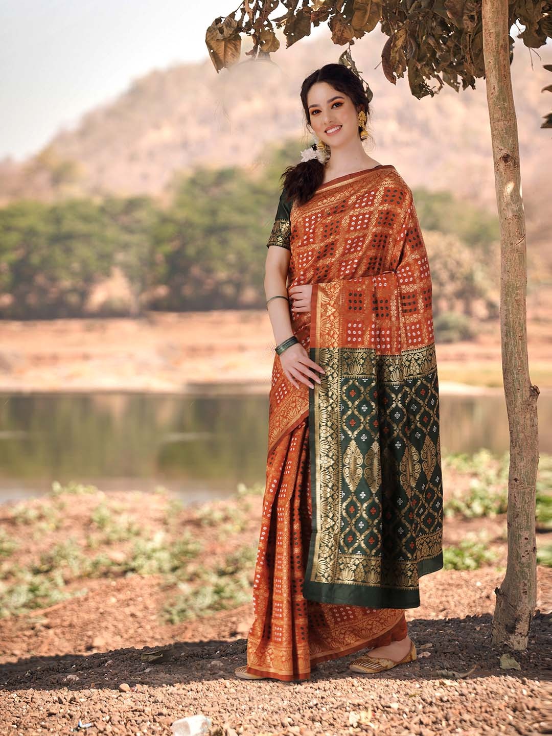 

KALINI Ethnic Motifs Printed Zari Detailed Bandhani Saree, Mustard