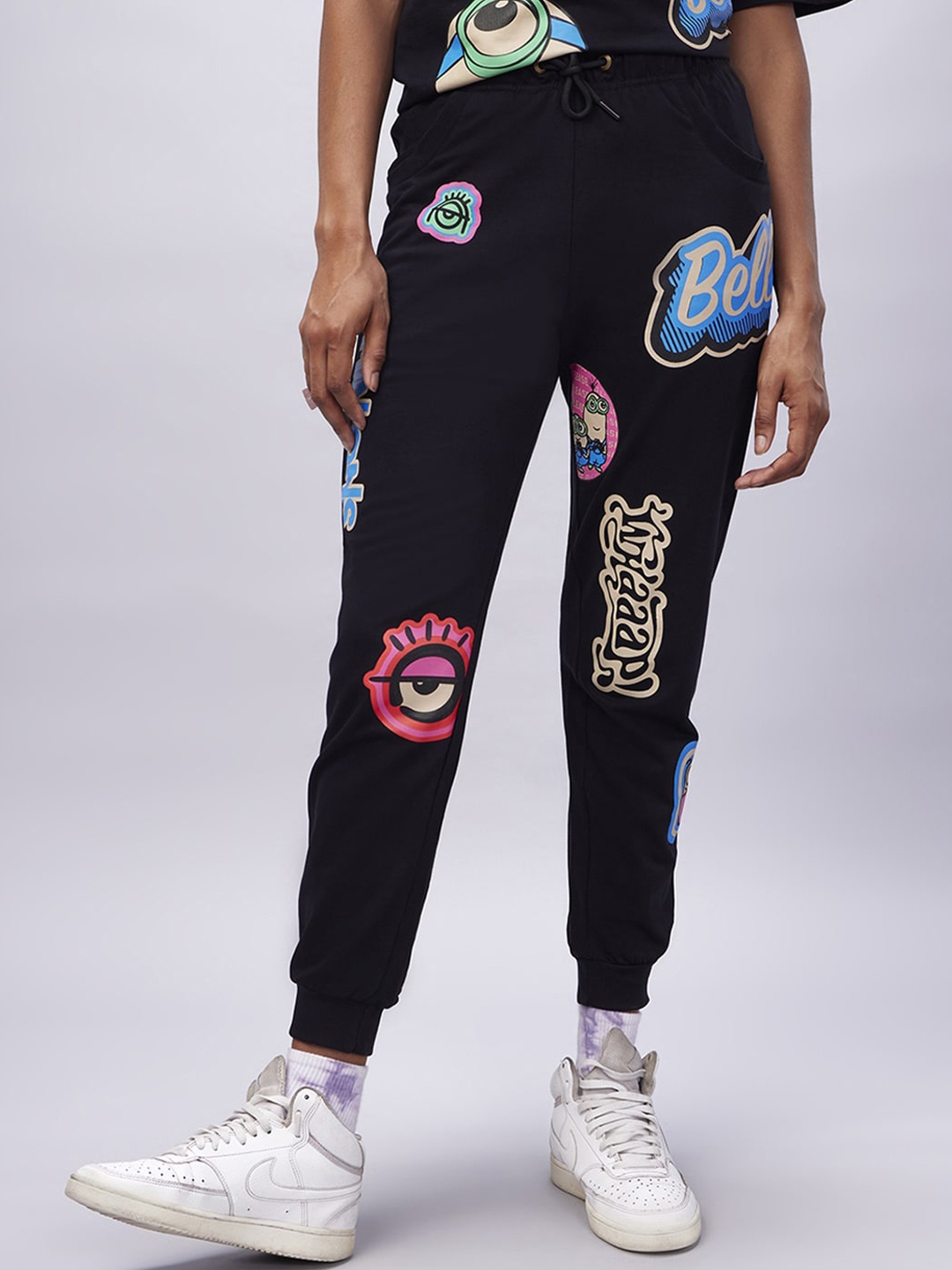 

Bewakoof Women Graphic Printed Relaxed Fit Pure Cotton Joggers, Black