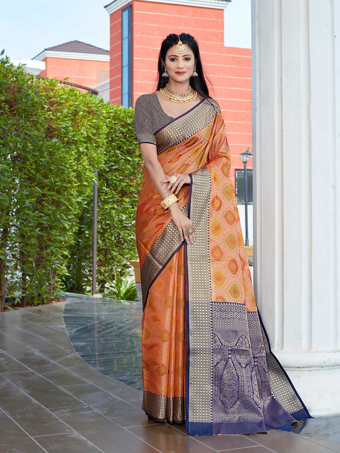 

Mitera Orange & Blue Ethnic Motifs Woven Design Zari Banarasi Saree