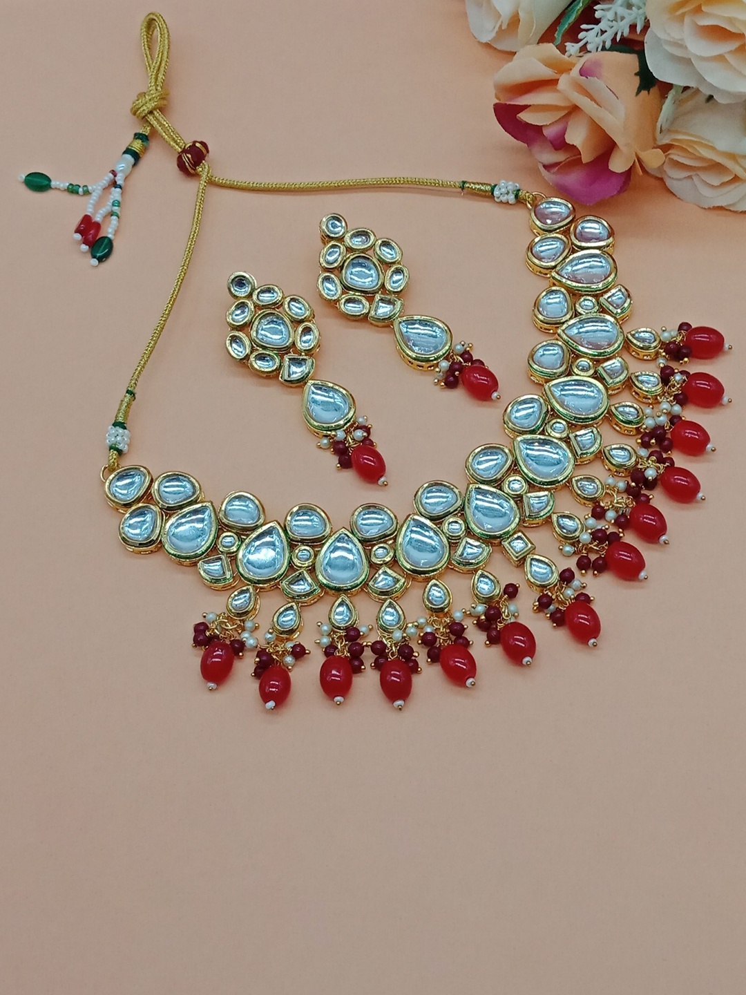 

AASHISH IMITATION Gold Plated Kundan Studded & Beaded Jewellery Set