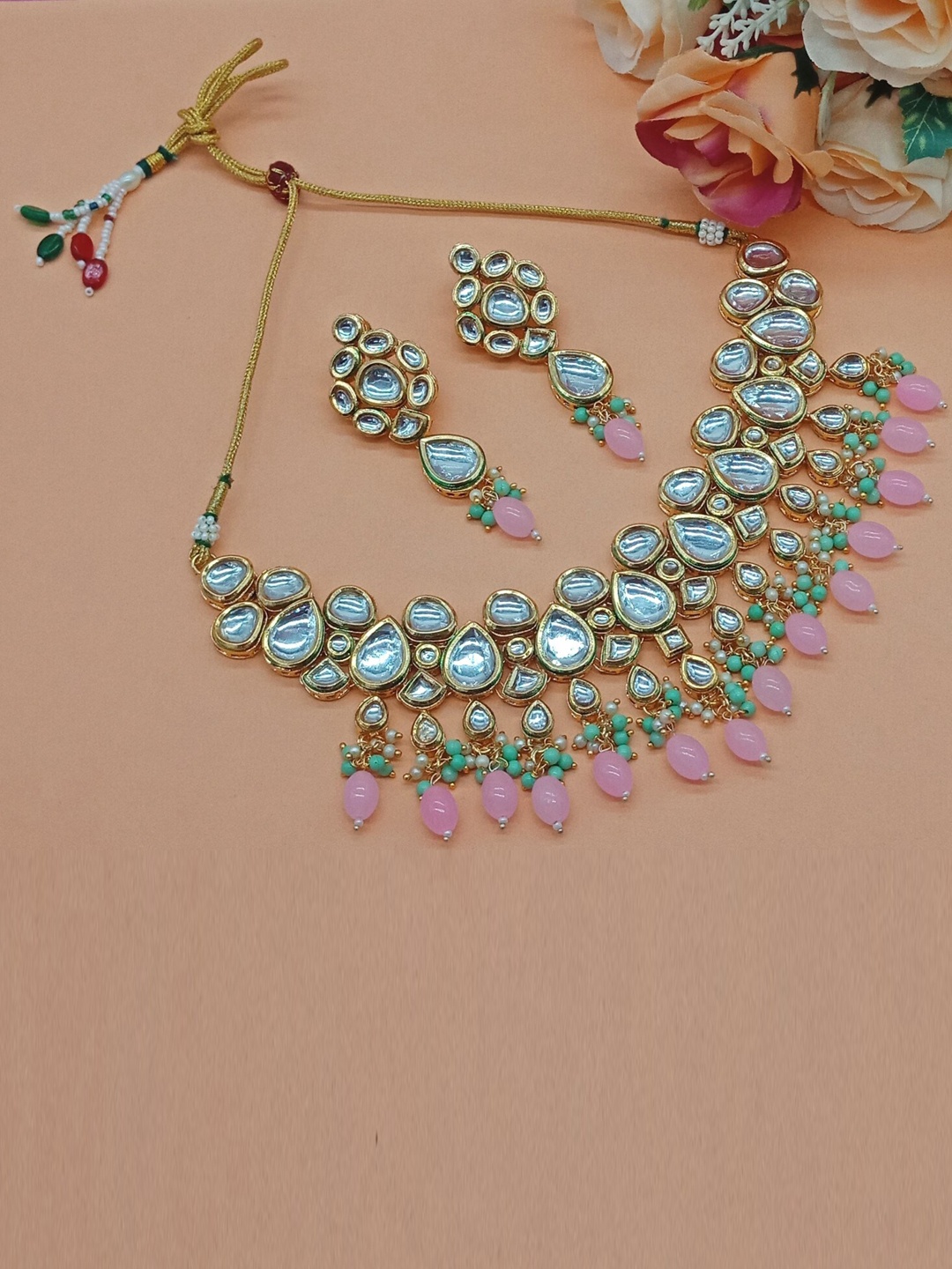 

AASHISH IMITATION Gold Plated Kundan Studded & Beaded Jewellery Set