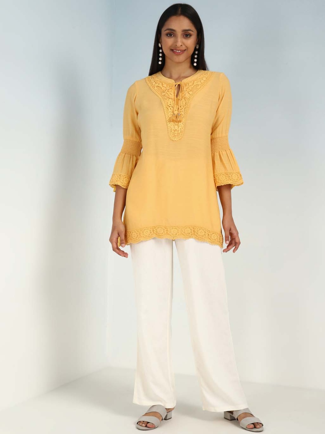 

Lakshita Ethnic Motifs Embroidered Tie-Up Neck Bell Sleeves Kurti, Yellow