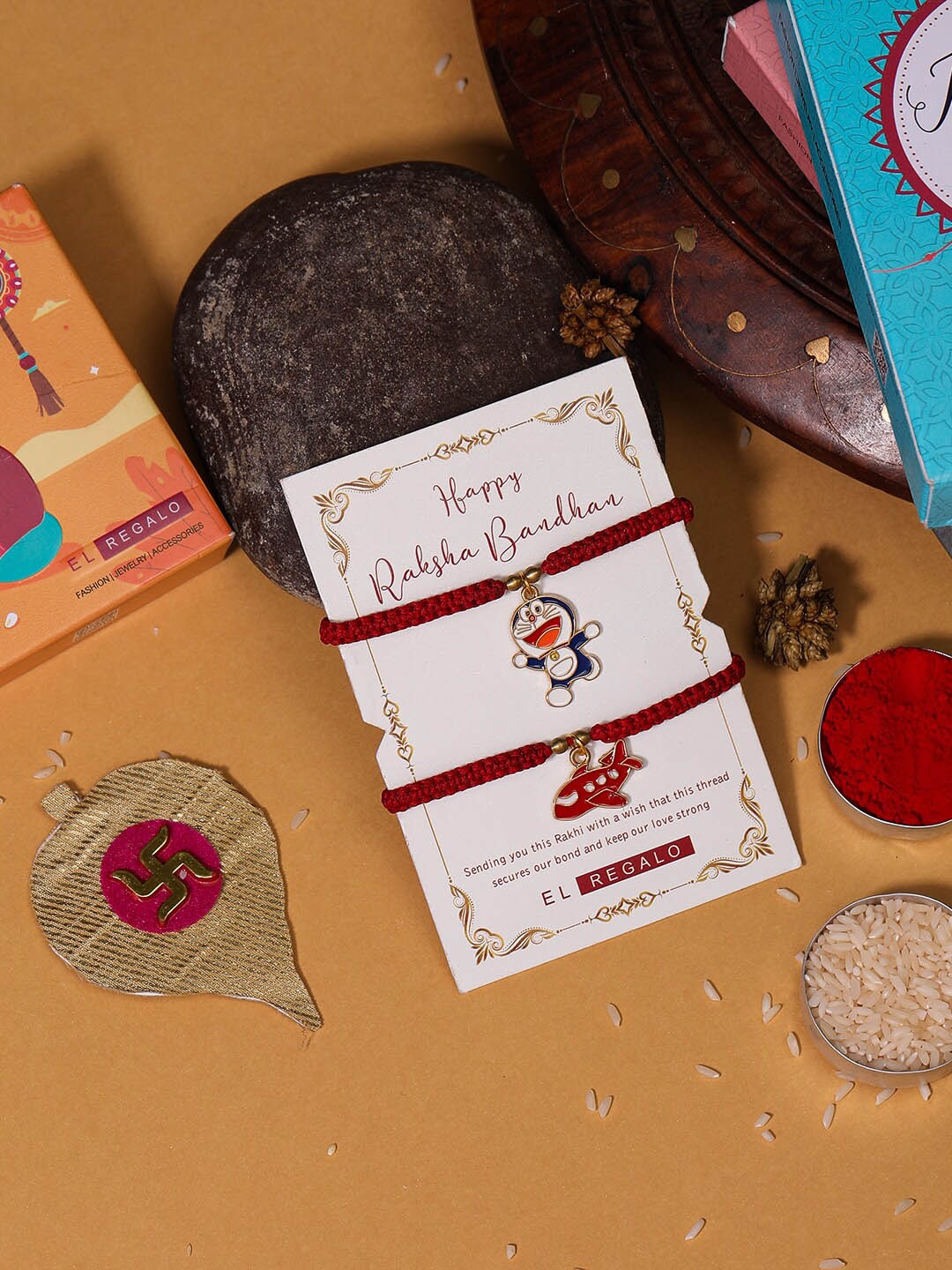 

EL REGALO Kids Set Of 2 Charm Detail Rakhis With Roli & Chawal, Red