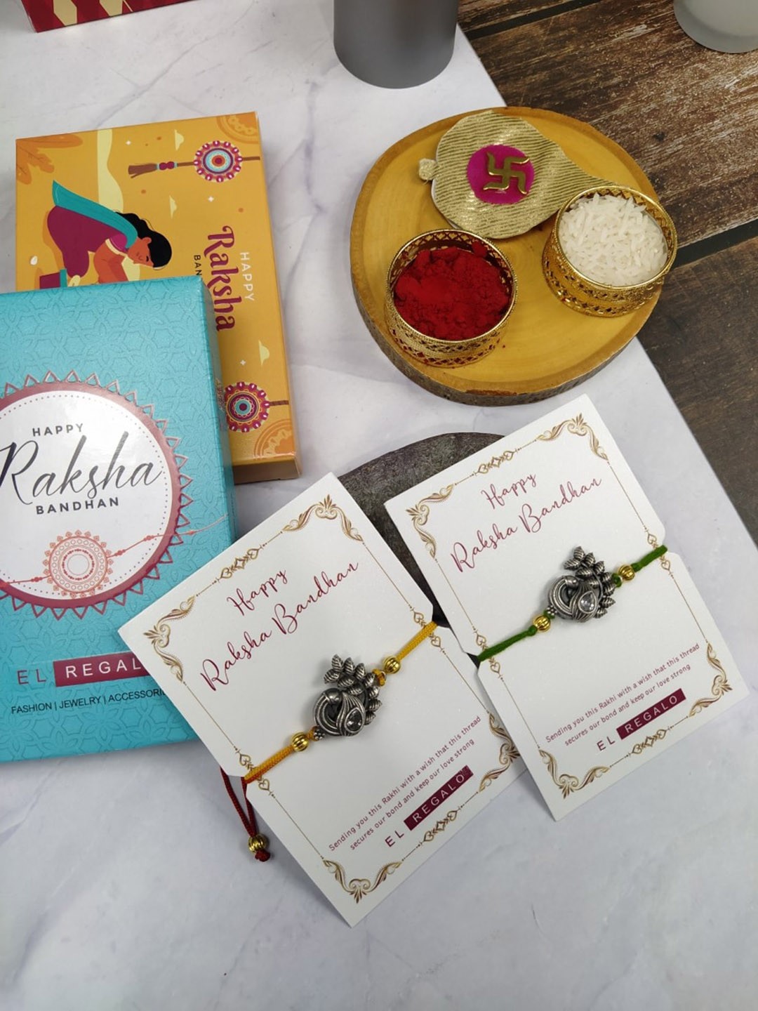 

EL REGALO Bhaiya Bhabhi Set Of 2 Charm Rakhi Combo With Roli Chawal, Yellow