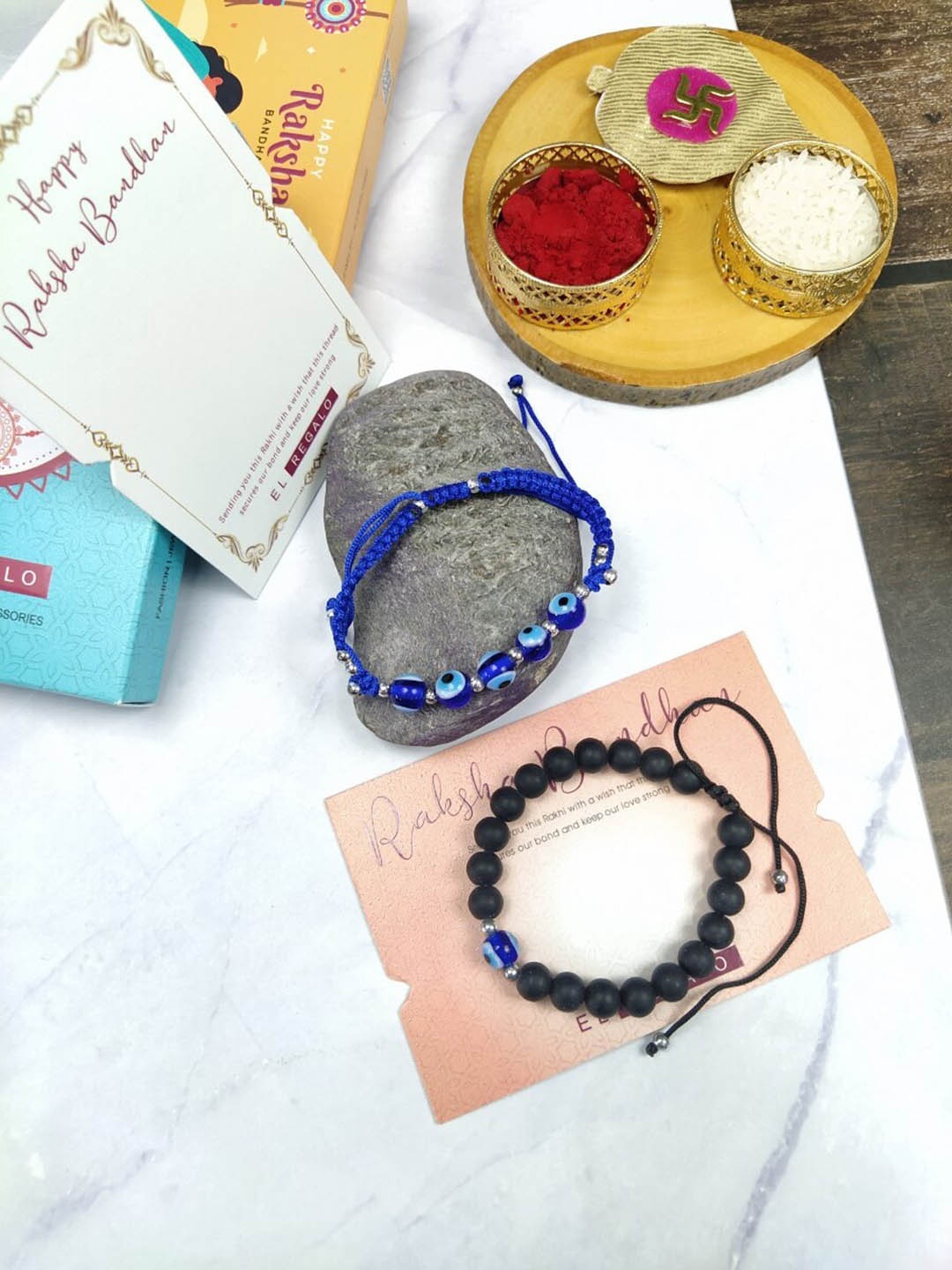

EL REGALO Bhaiya Bhabhi 2 Pcs Evil Eye Rakhi With Roli Chawal and Card, Blue