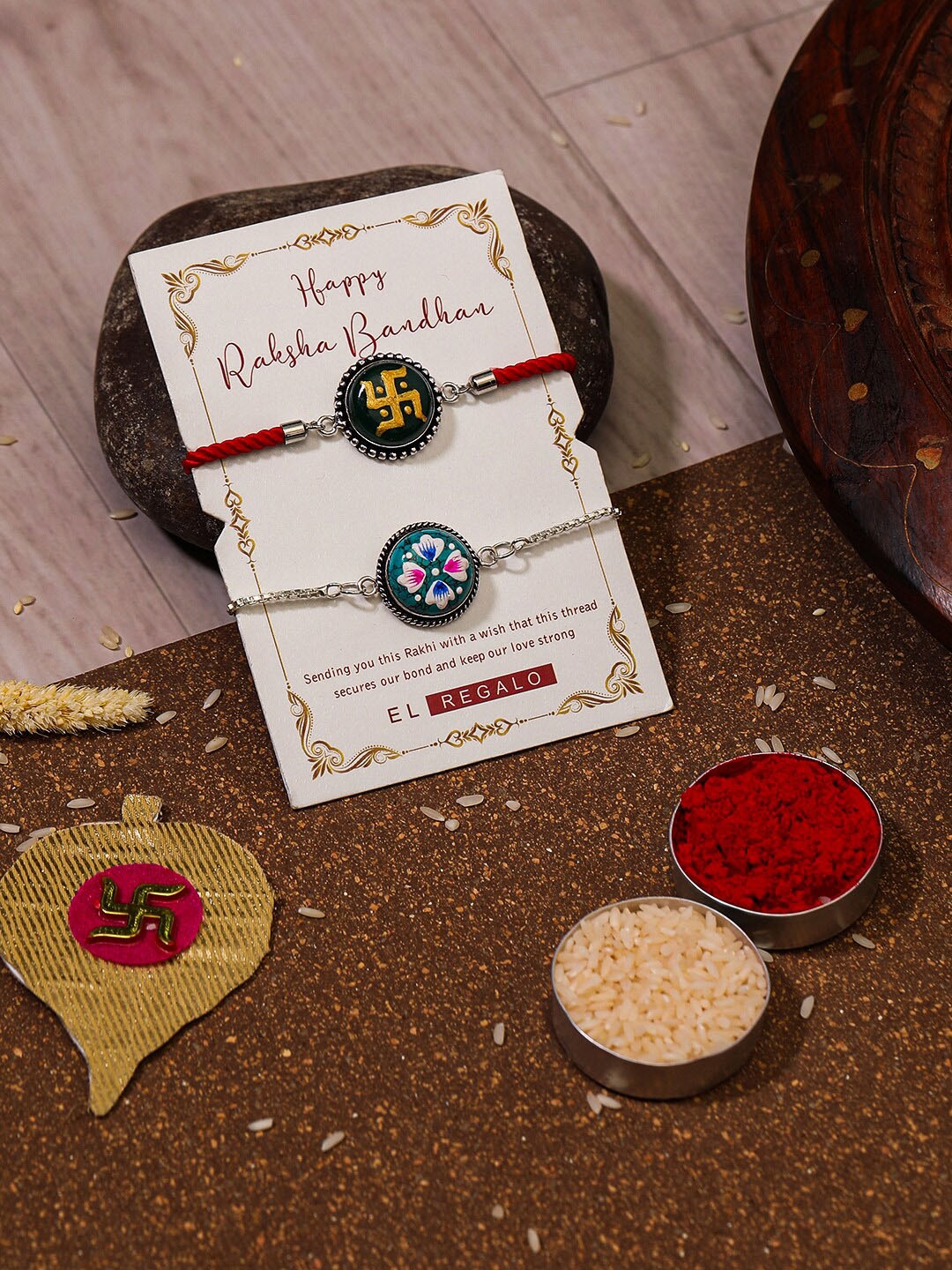 

EL REGALO Bhaiya Bhabhi Set Of 2 Charm Rakhi Combo With and Card, Roli Chawal, Red