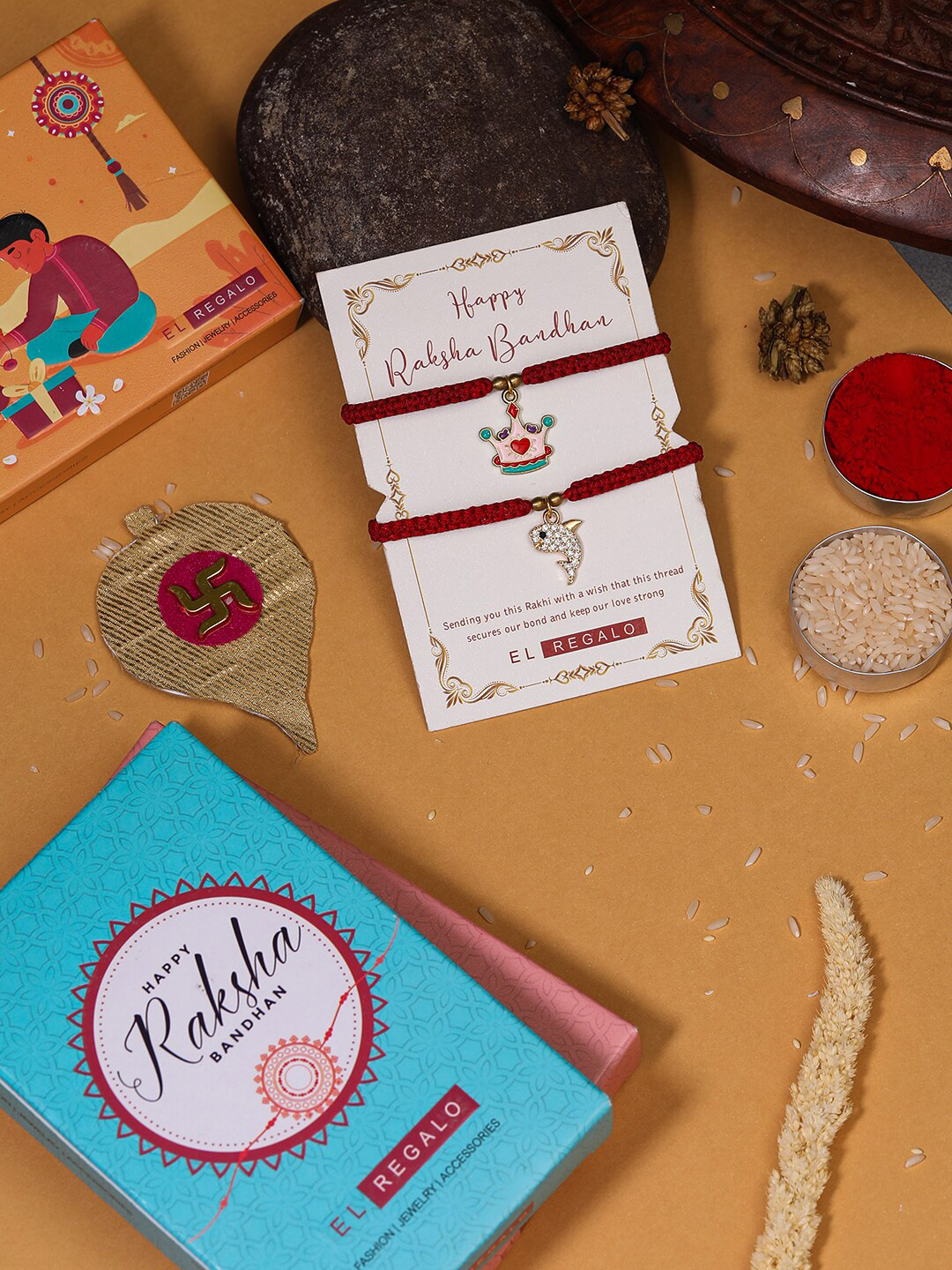 

EL REGALO Set Of 2 Charm Detail Rakhis With Roli & Chawal, Red