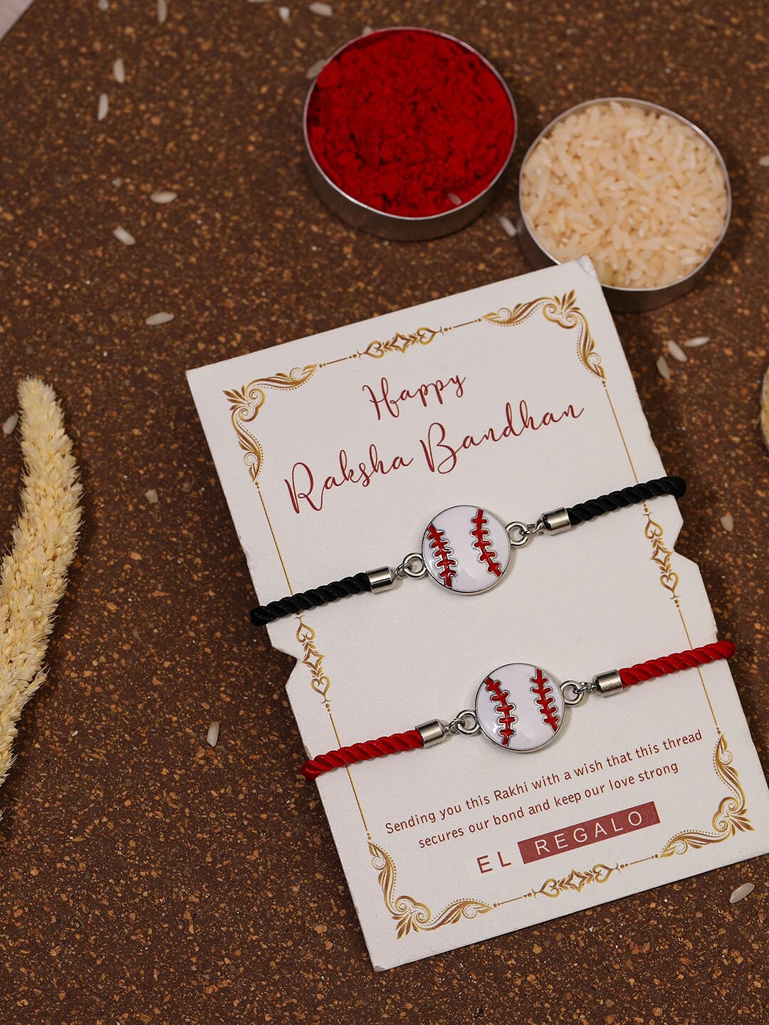 

EL REGALO Bhaiya Bhabhi Set Of 2 Charm Rakhi Combo With Roli Chawal, Red