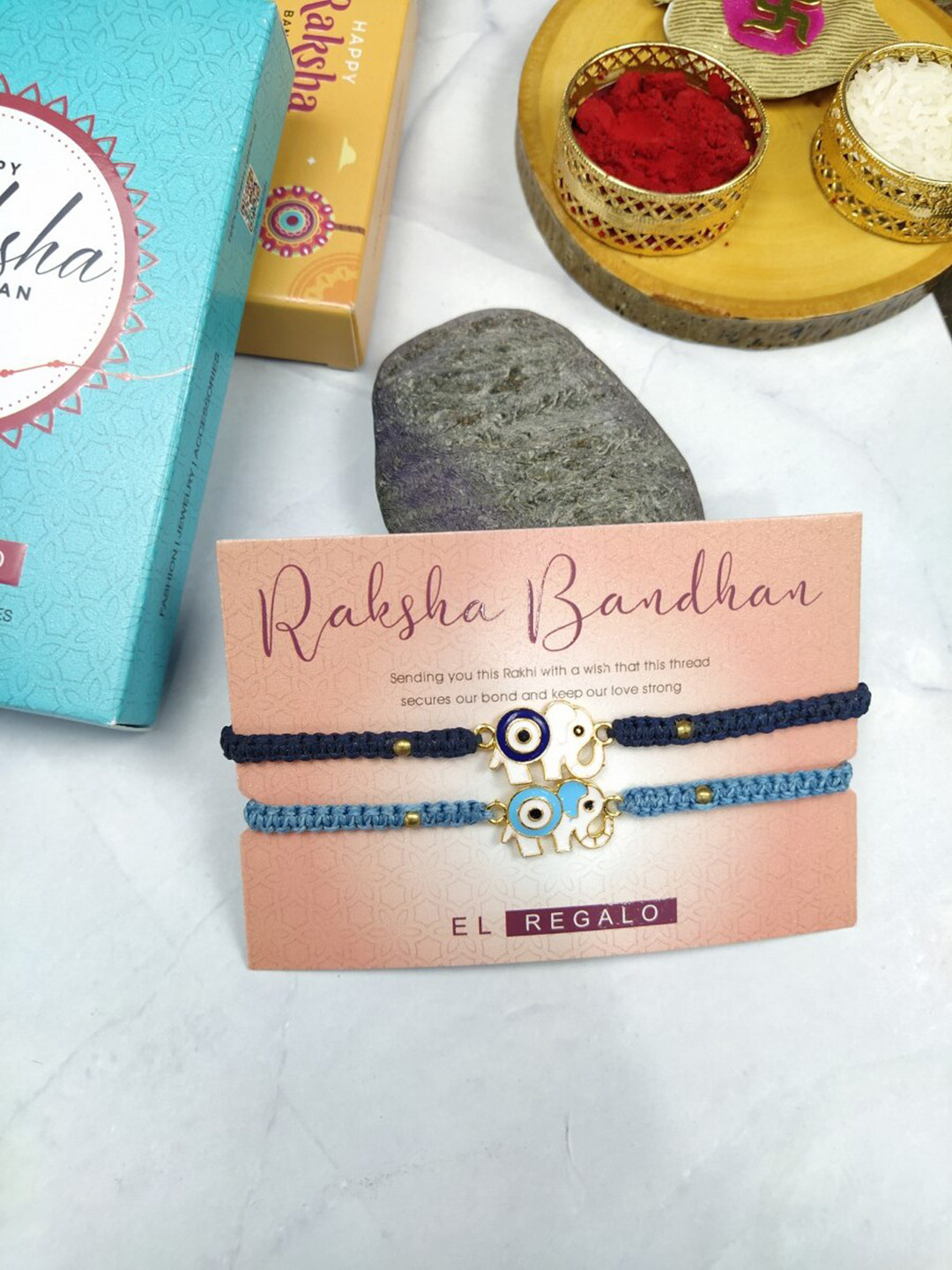 

EL REGALO Bhaiya Bhabhi 2 Pcs Evil Eye Rakhi With Roli Chawal and Card, Blue