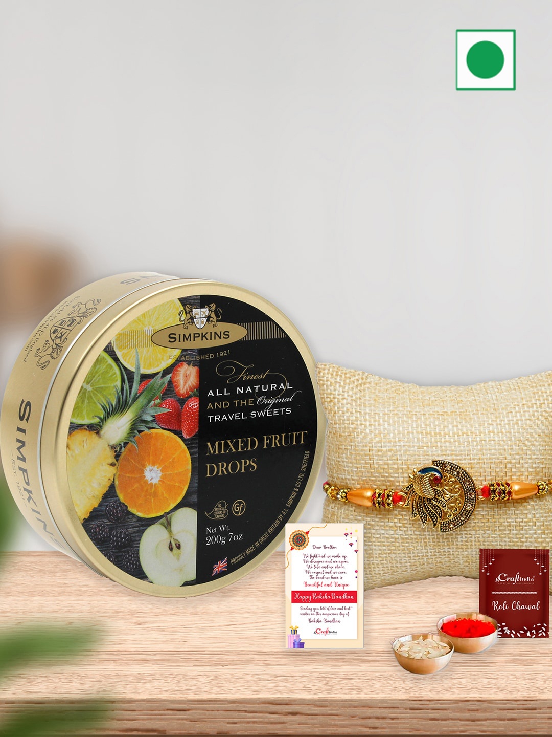 

eCraftIndia Simpkins Mixed Fruit Drops Candy With Peacock Charm Rakhi -100g, Yellow
