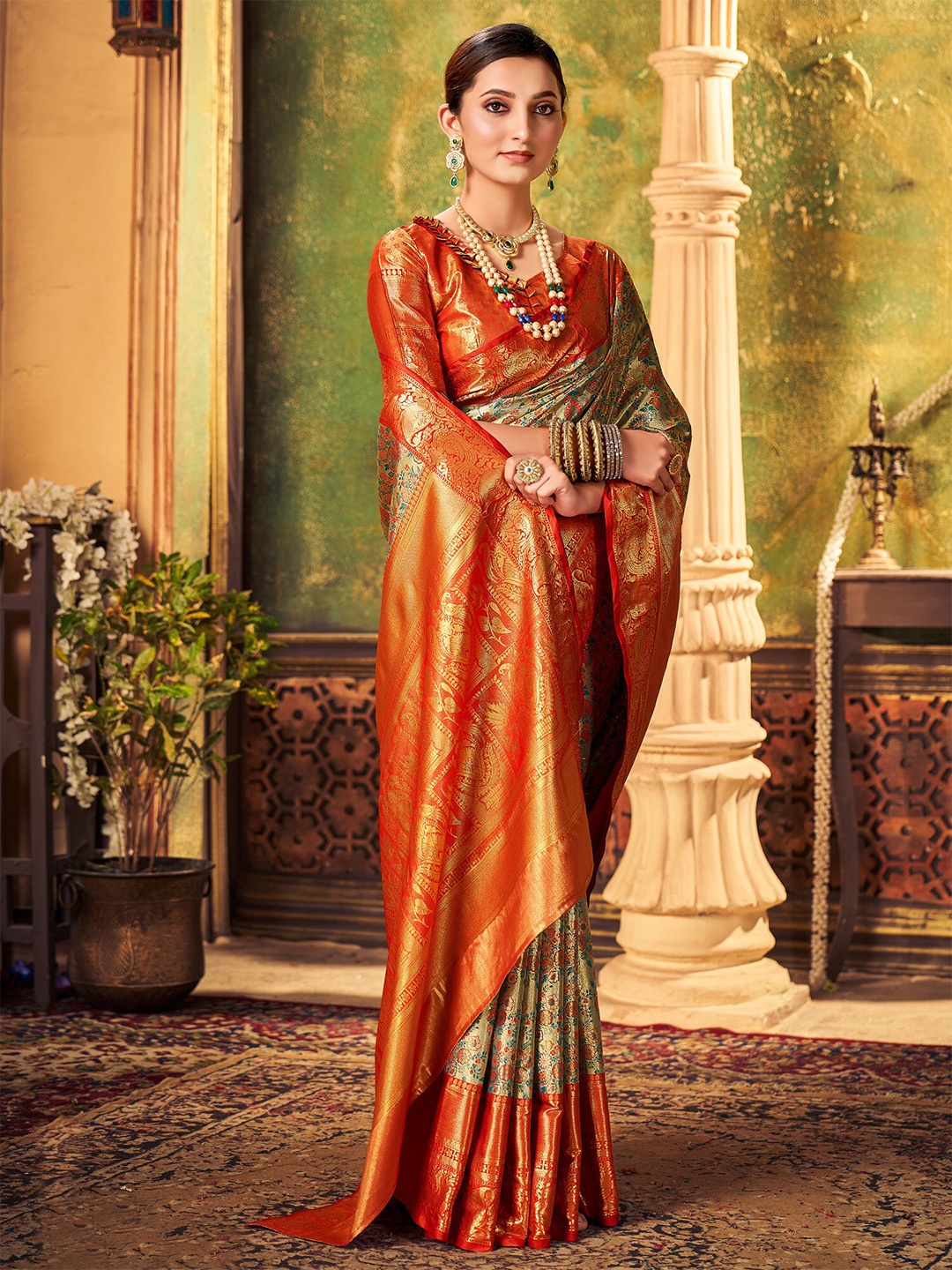 

Mitera Gold-Toned & Red Ethnic Motifs Woven Design Zari Kanjeevaram Saree