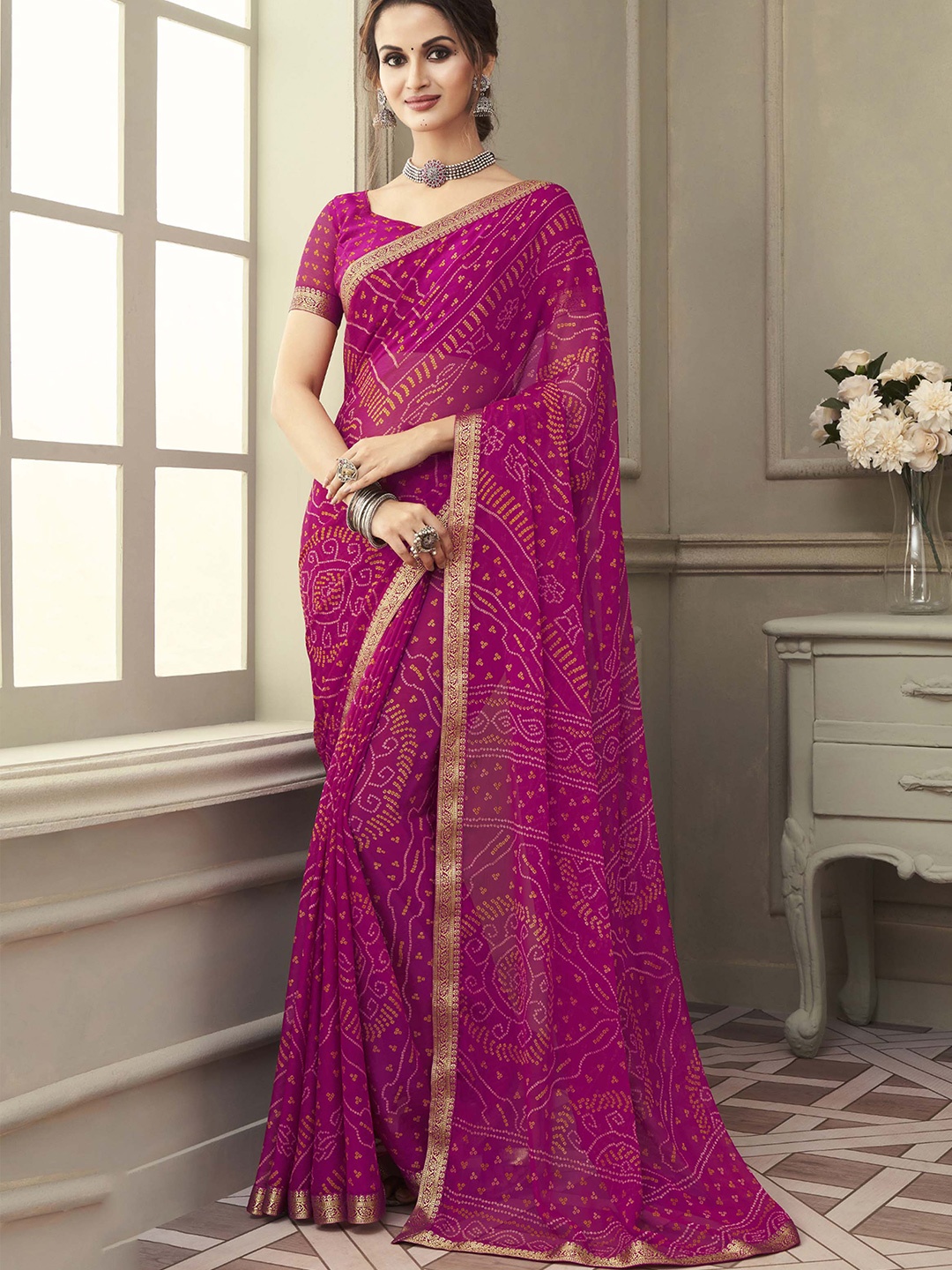 

Mitera Pink & Gold-Toned Bandhani Printed Zari Saree