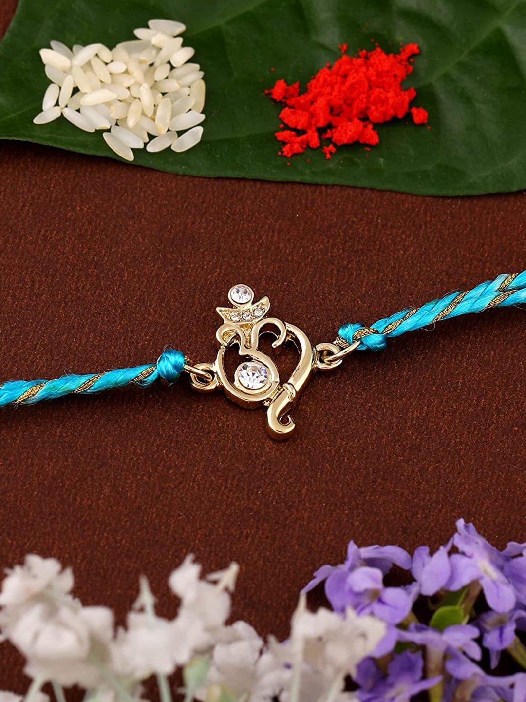 

Estele Gold-Plated Crystals-Studded Om Charm Rakhi