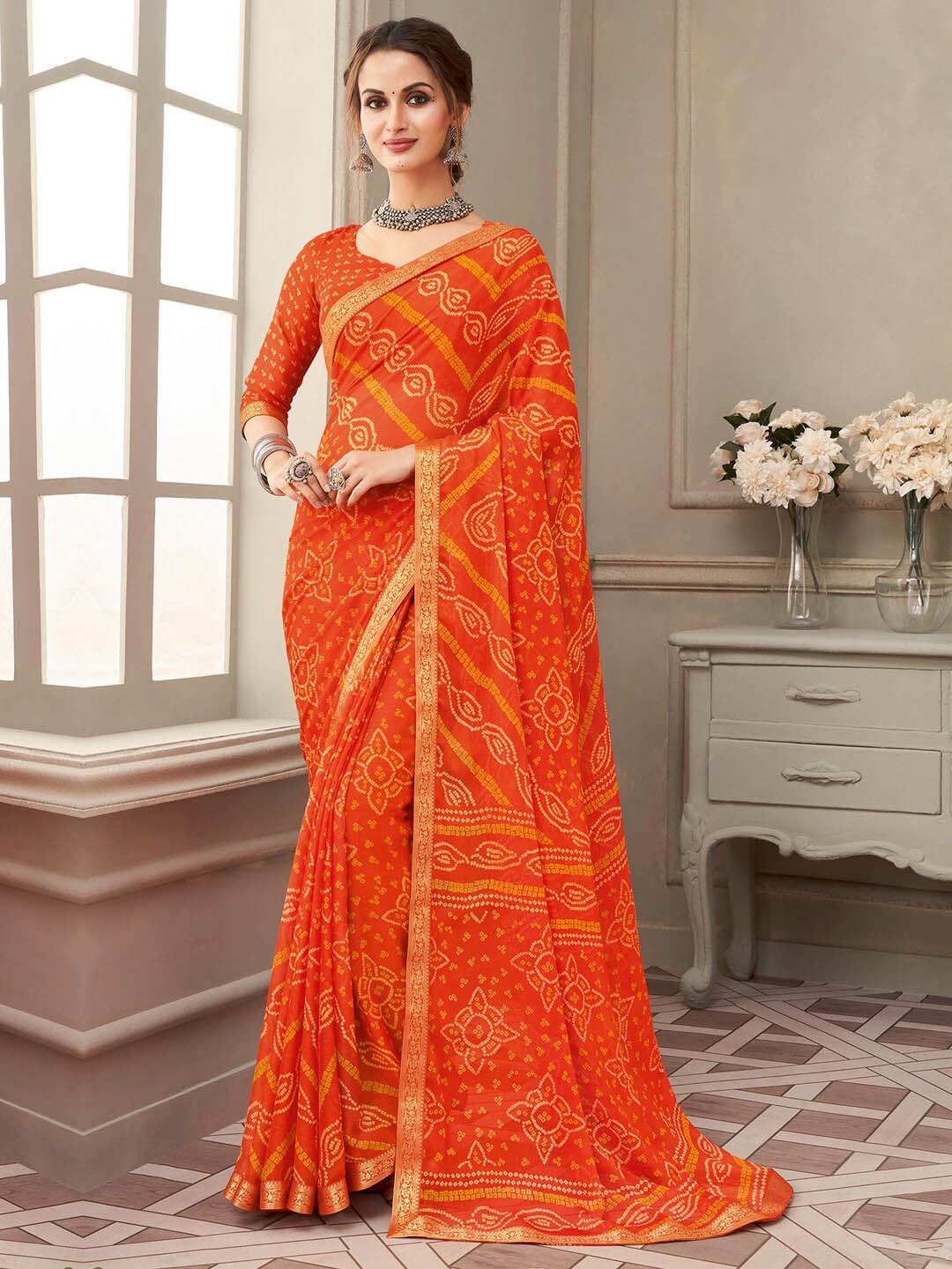 

Anouk Rustic Orange & White Bandhani Printed Zari Pure Chiffon Bagru Saree