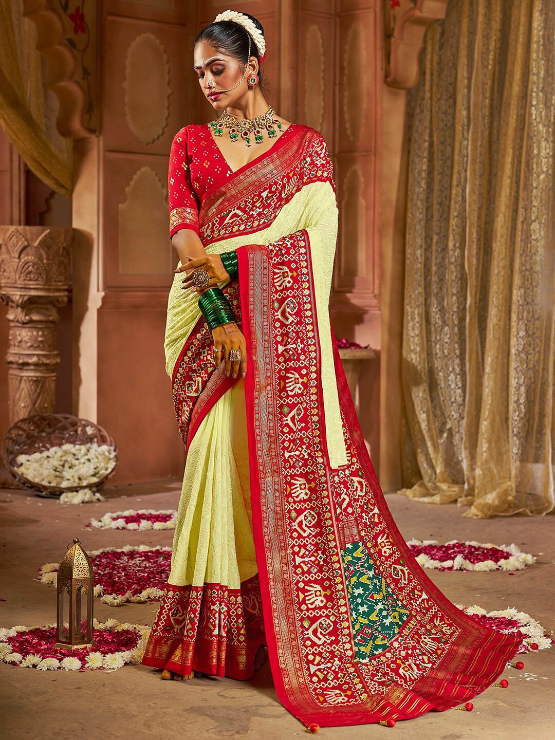 

Anouk Ethnic Motifs Printed Zari Patola Saree, Yellow