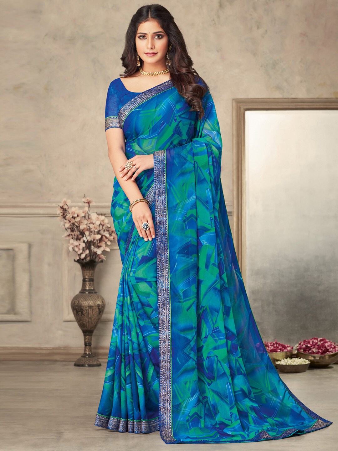 

Anouk Blue & Green Geometric Printed Zari Pure Chiffon Bagru Saree