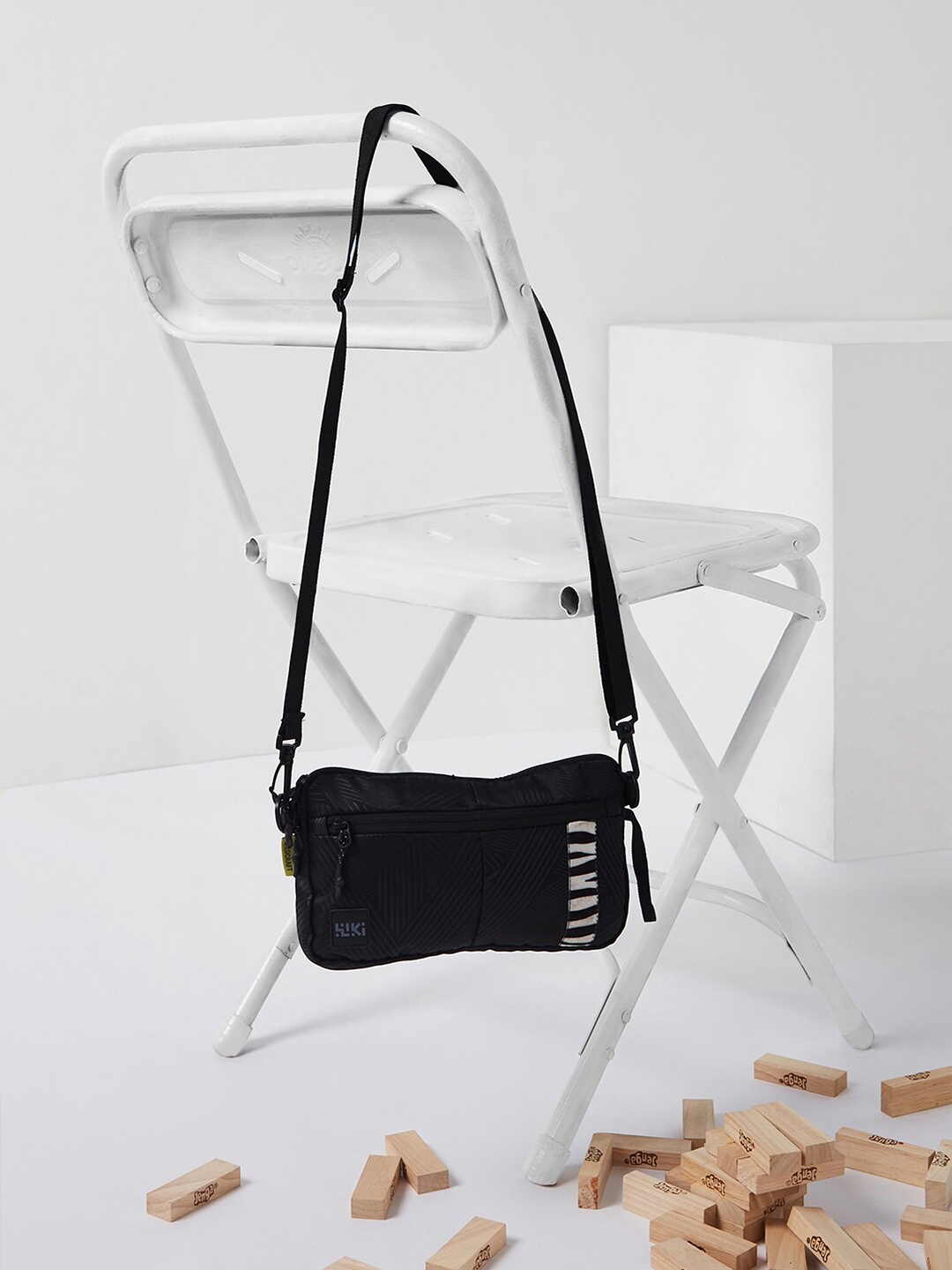 

Wildcraft Unisex Striped Structured Sling Bag, Black