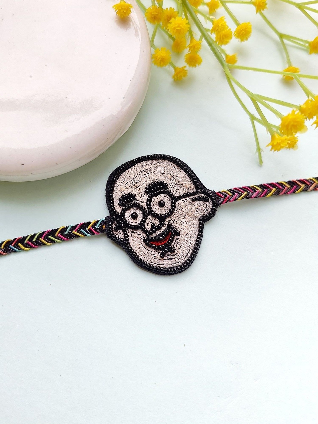 

Crunchy Fashion Men Beaded Motu Patlu Rakhi, Beige