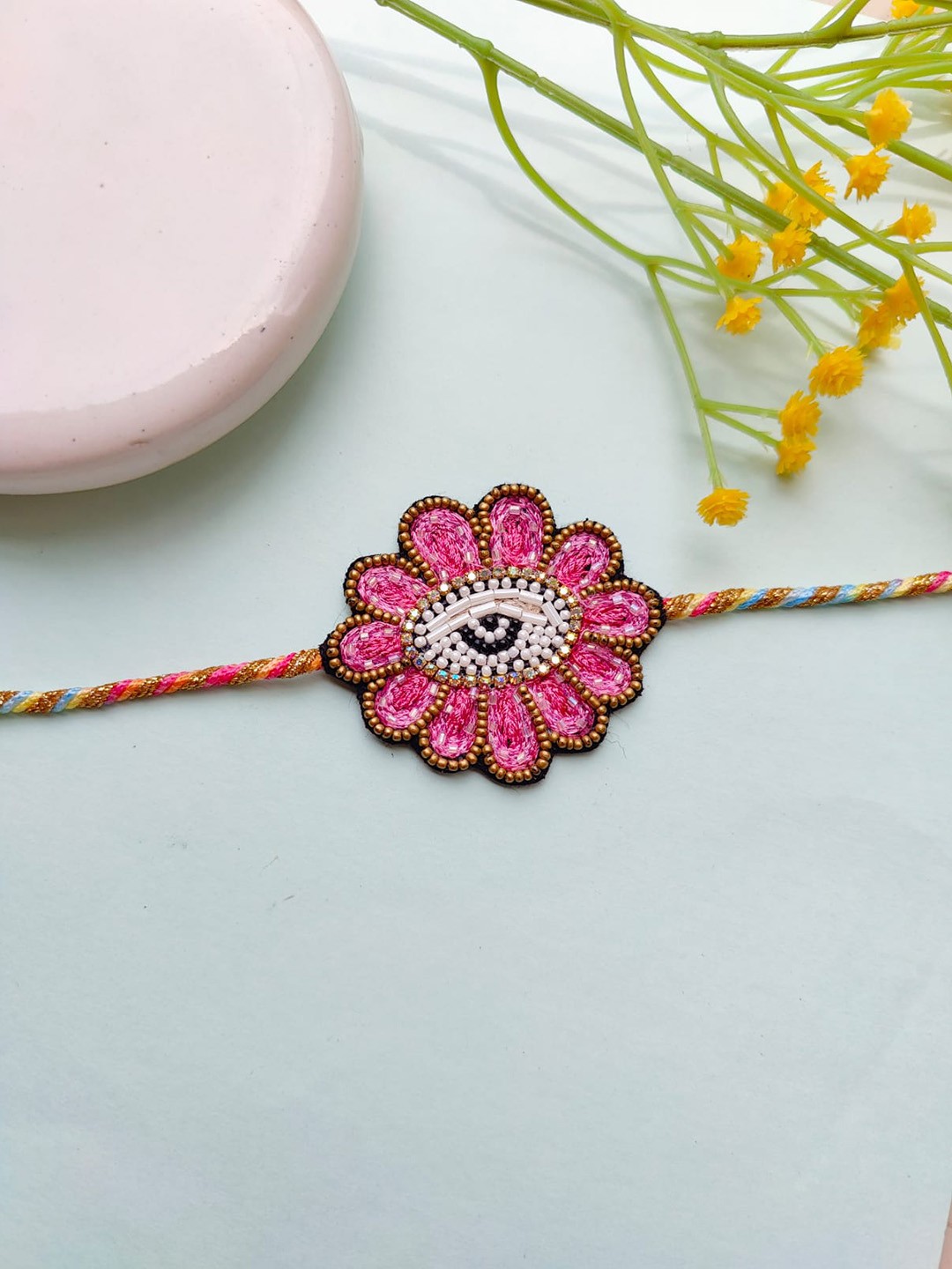 

Crunchy Fashion Men Beaded Flower Thread Rakhi, Pink