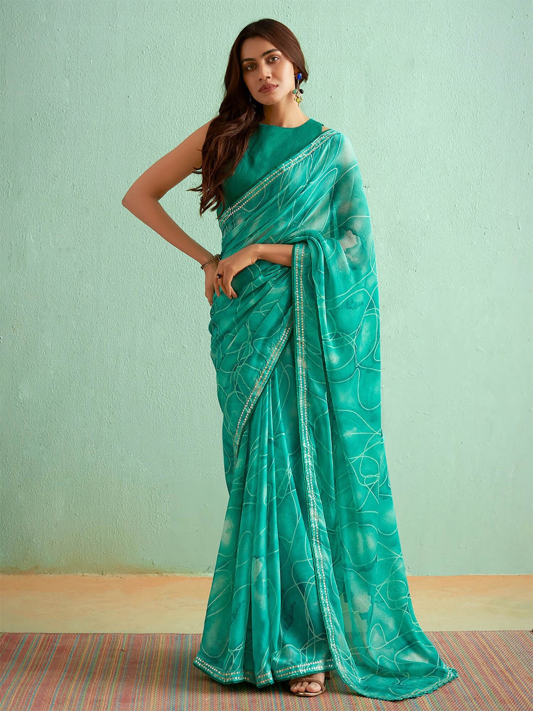 

Saree mall Abstract Printed Sequinned Pure Georgette Sarees, Green