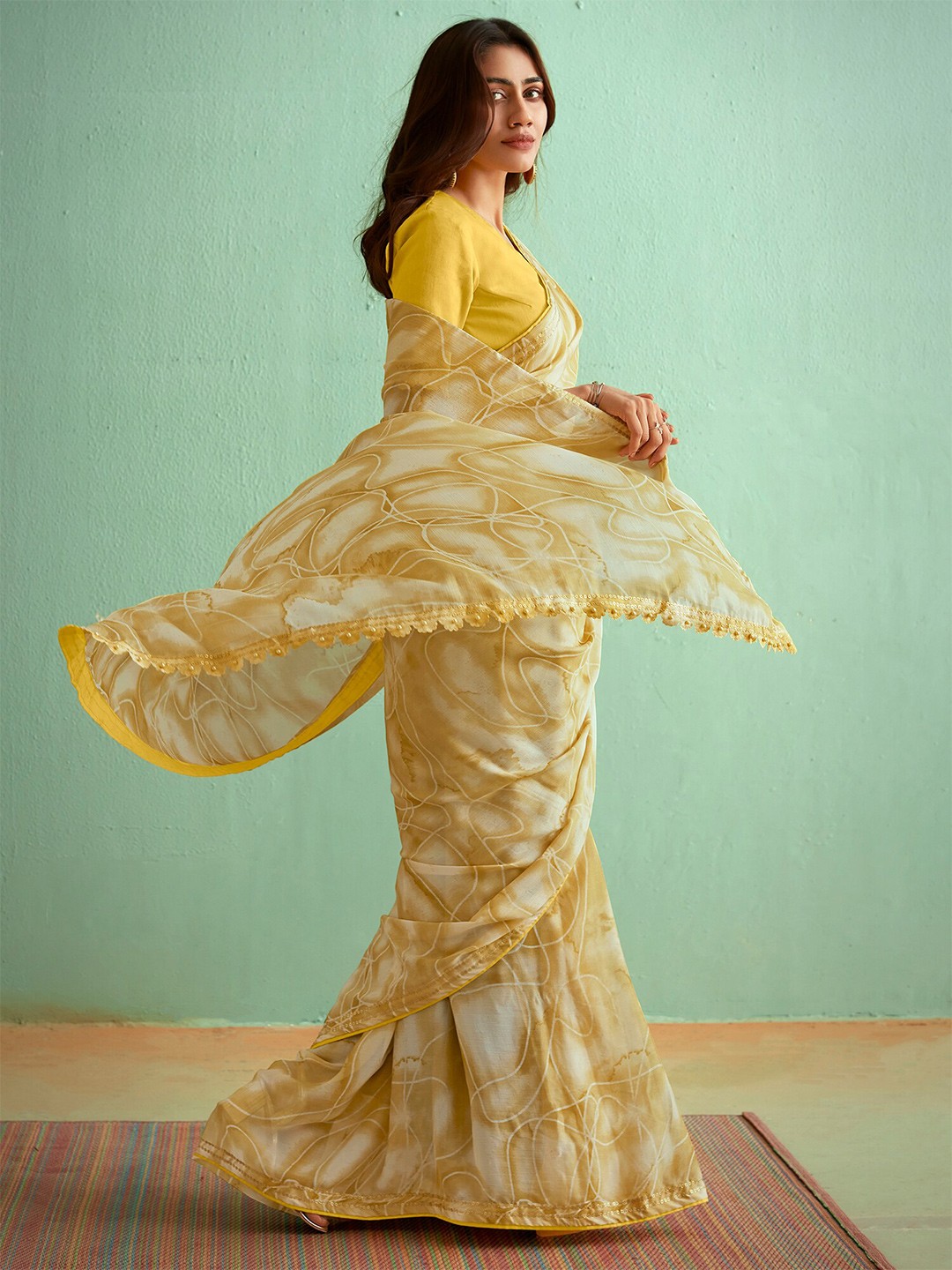 

Saree mall Abstract Printed Sequinned Pure Georgette Sarees, Mustard