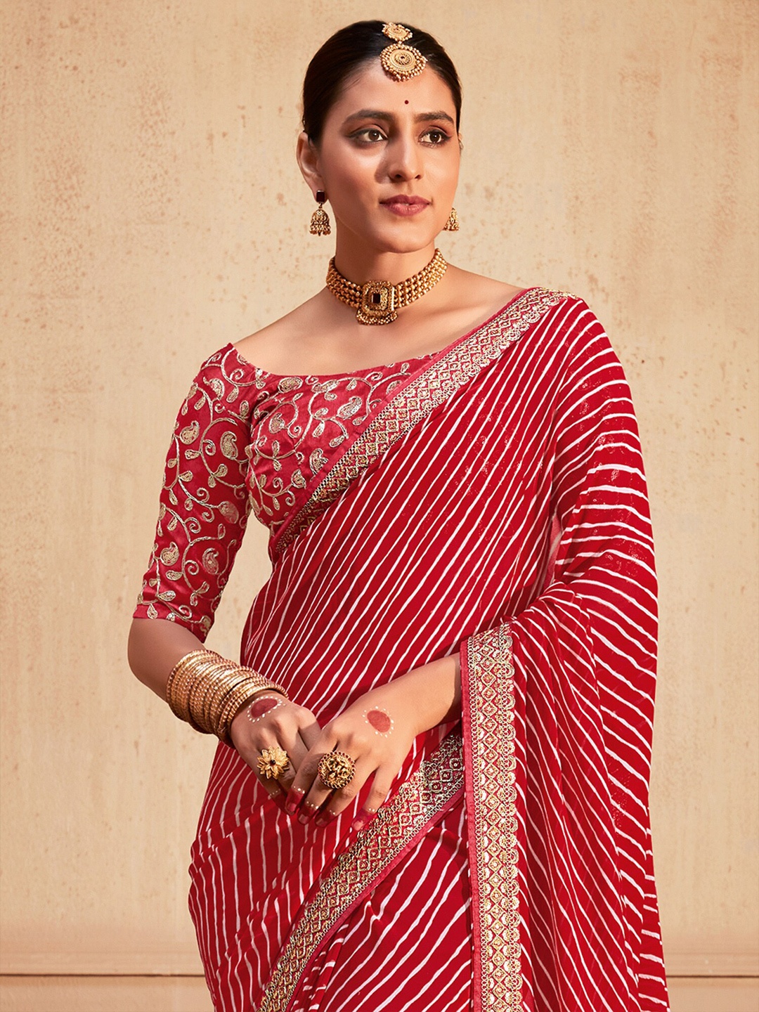 

Saree mall Printed Sequinned Poly Georgette Leheriya Sarees, Red