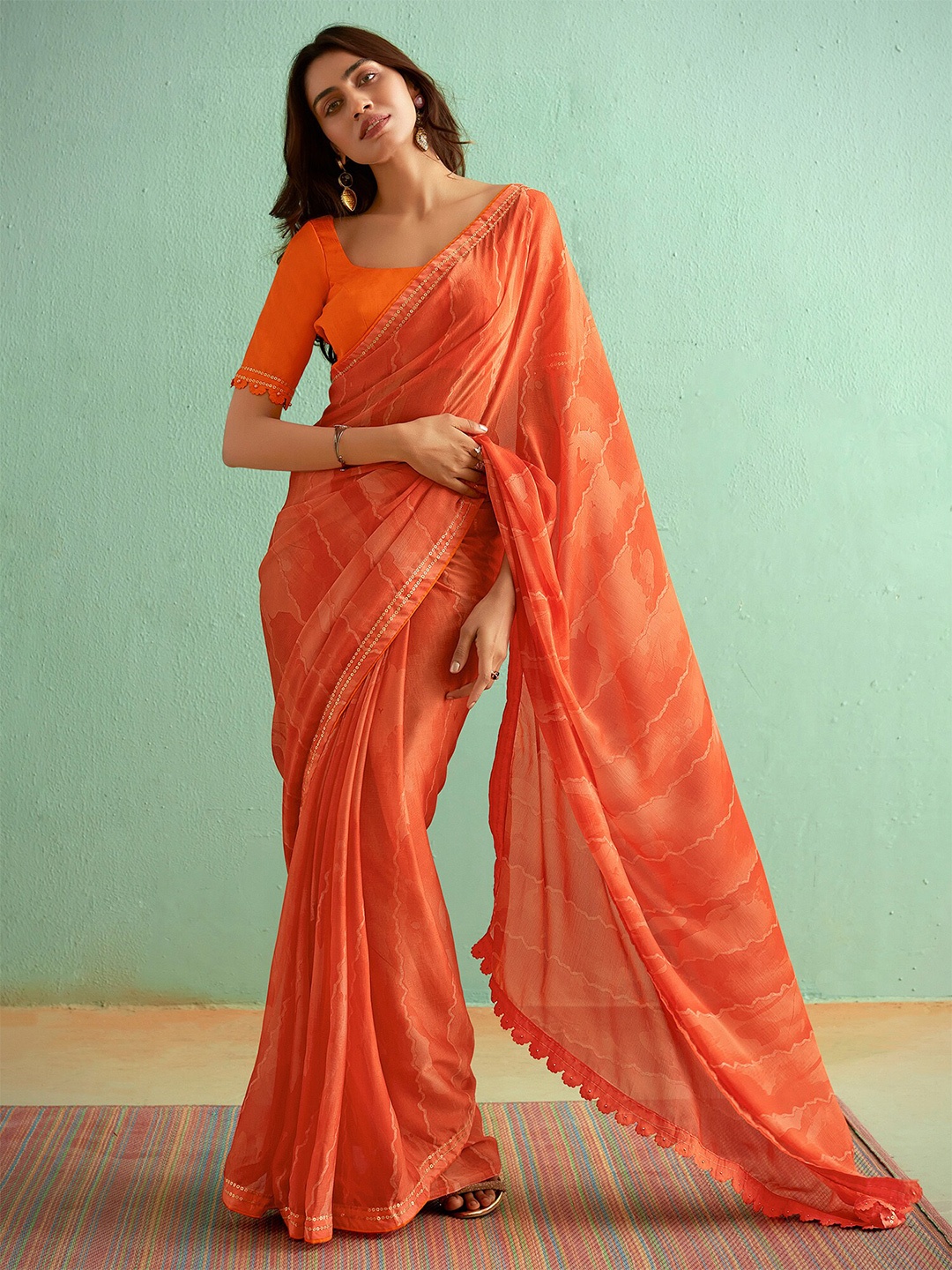 

Saree mall Abstract Printed Sequinned Sarees, Orange