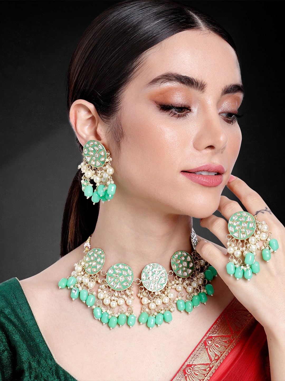 

Peora Women Gold-Plated Kundan Studded Choker Necklace with Earrings & Finger Ring, Green