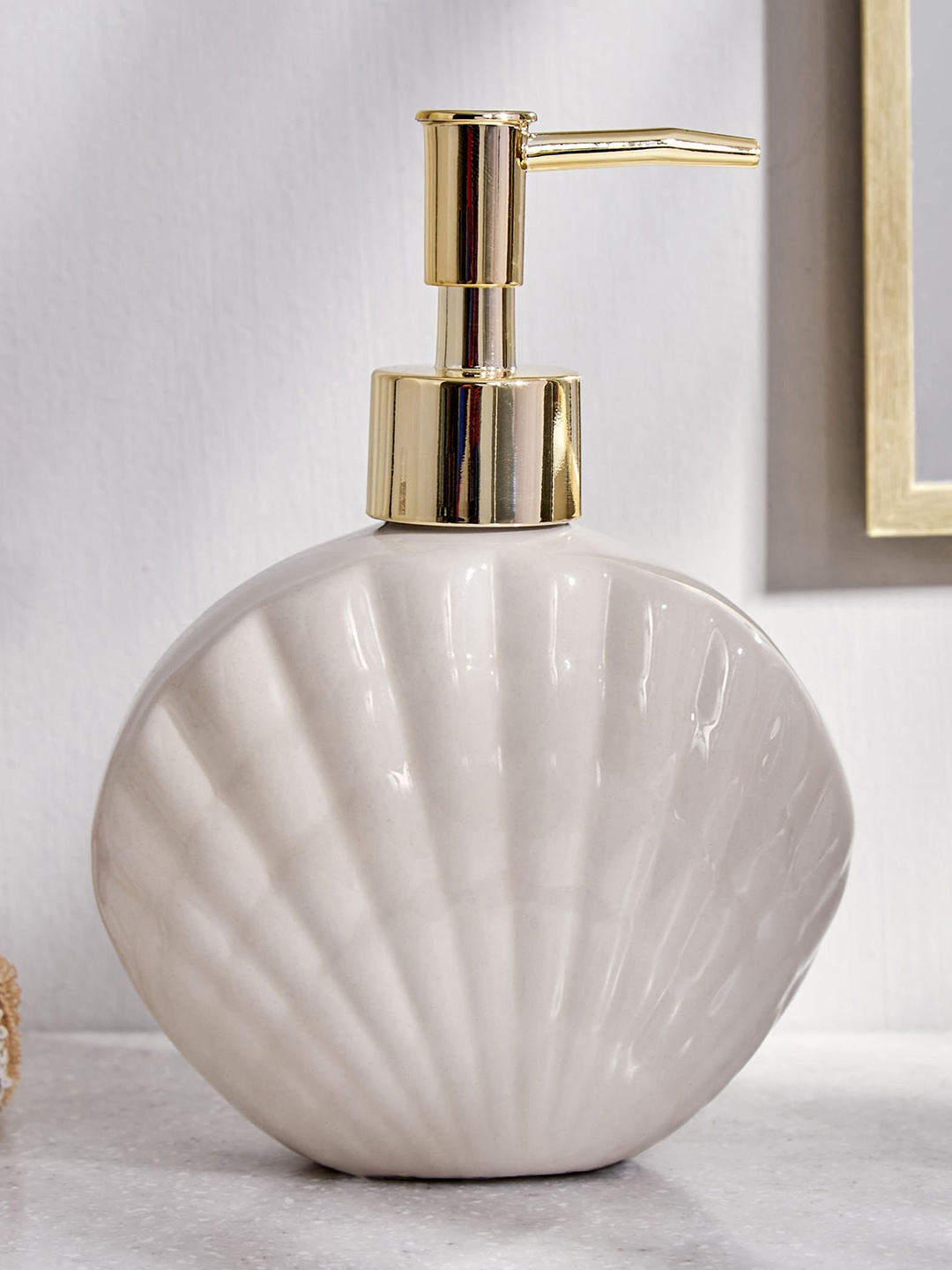 

Home Centre Off-White Textured Soap Dispenser