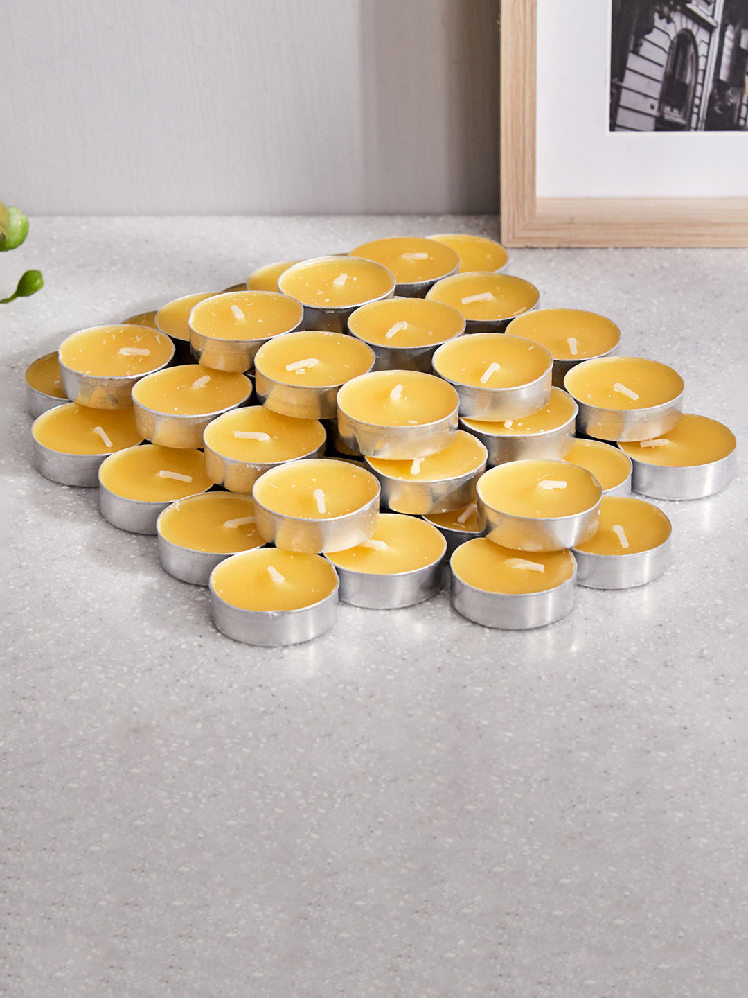 

Home Centre Yellow 50 Pieces T-Light Candles