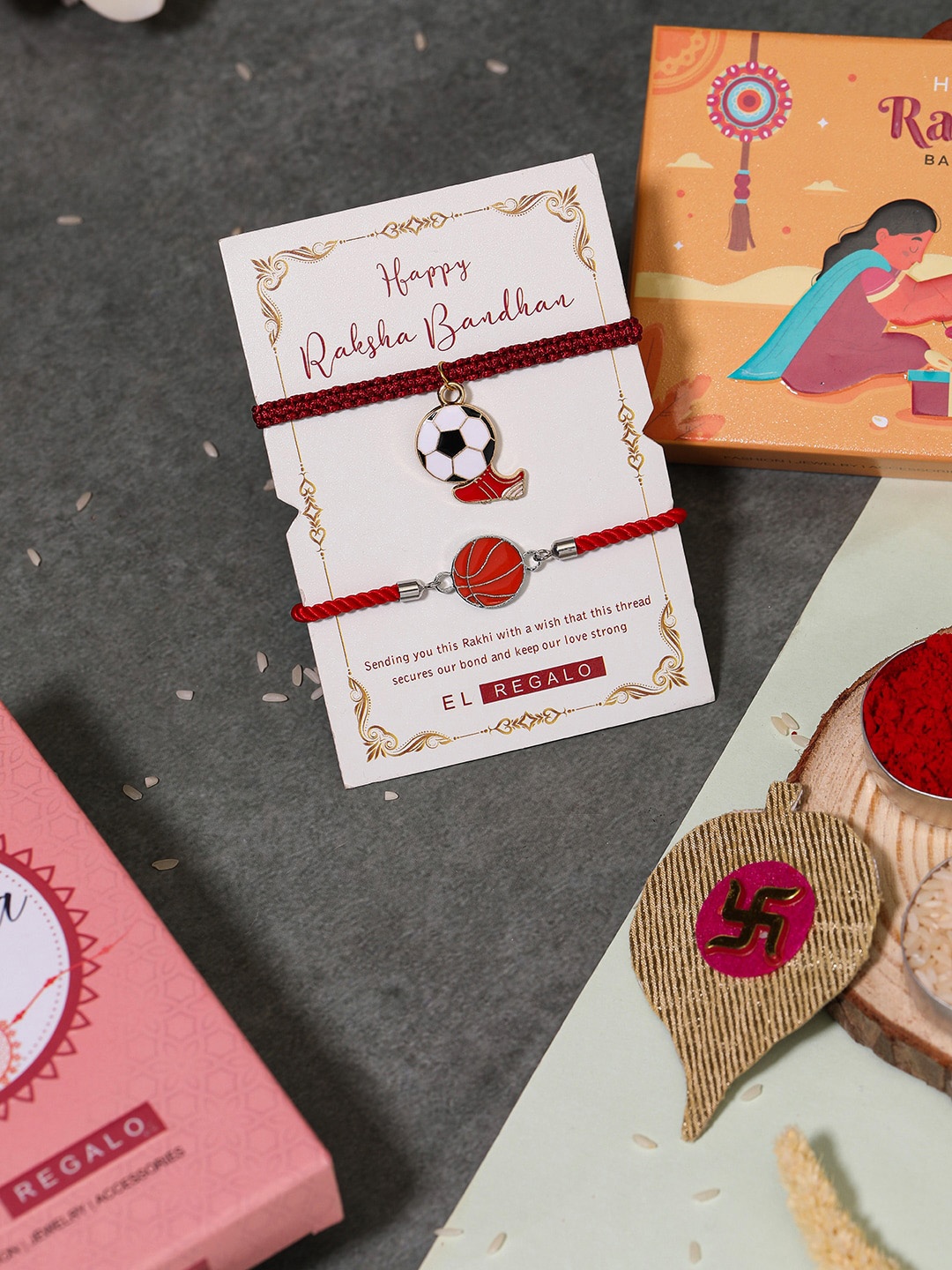 

EL REGALO Set Of 2 Football & Baseball Rakhis With Roli And Chawal, Red