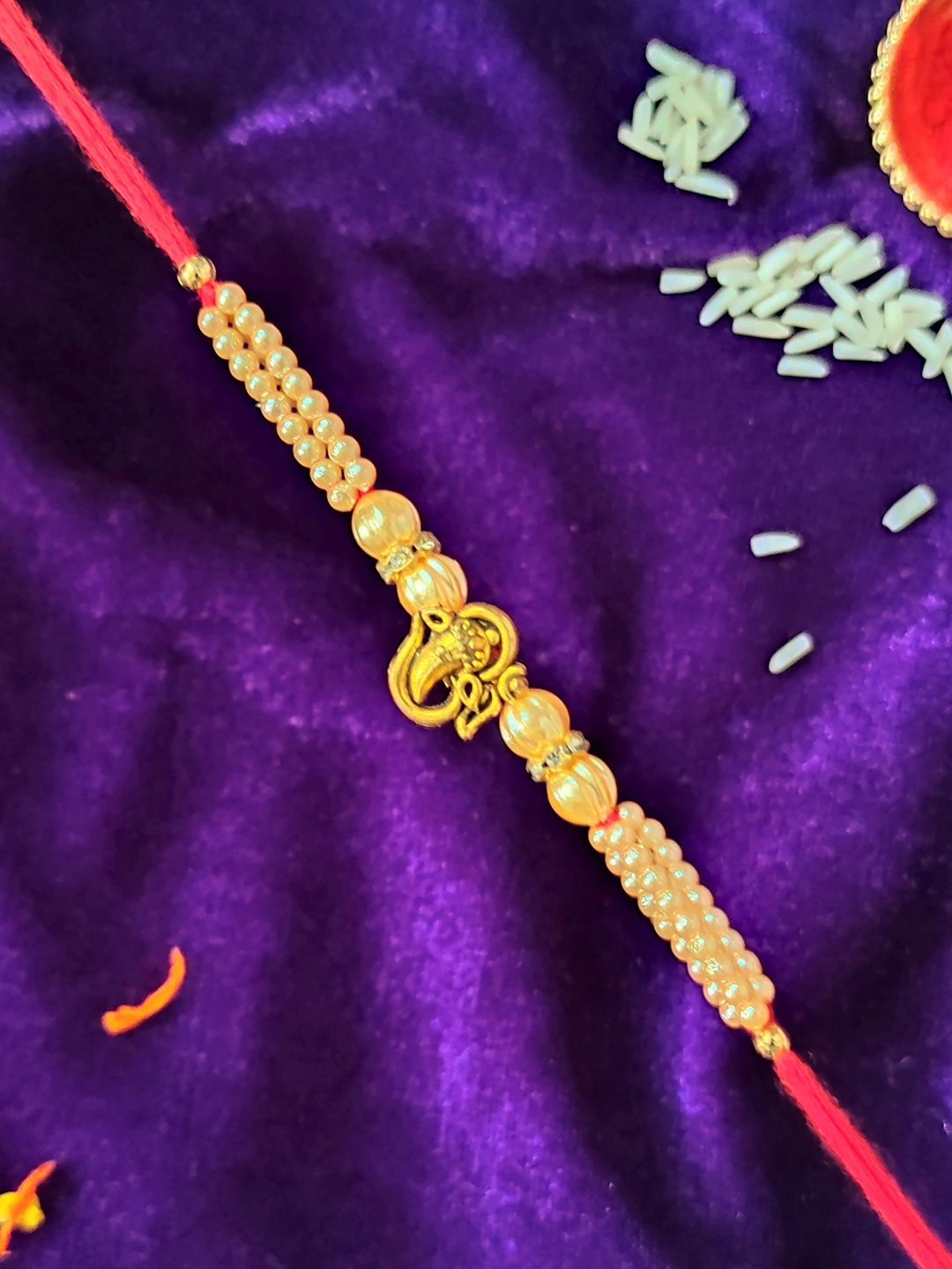 

CRAYTON Beaded Om Ganesha Rakhi, Gold