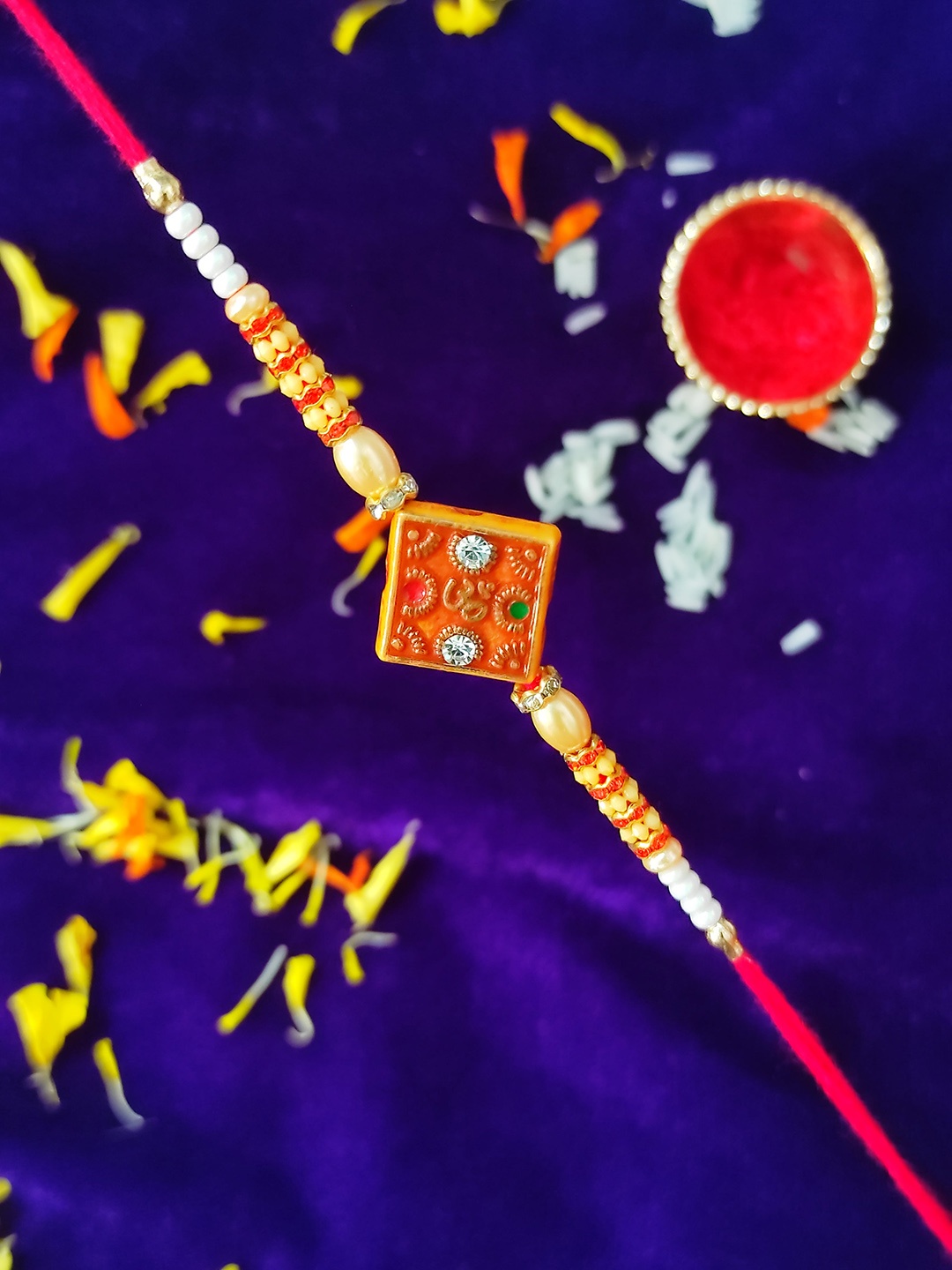 

CRAYTON Stone-studded & Beaded Om Charm Rakhi, Gold