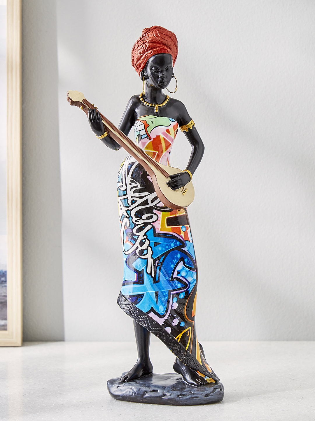

Home Centre Blue & Orange 3-Pieces Couple African Kora Figurine Showpieces
