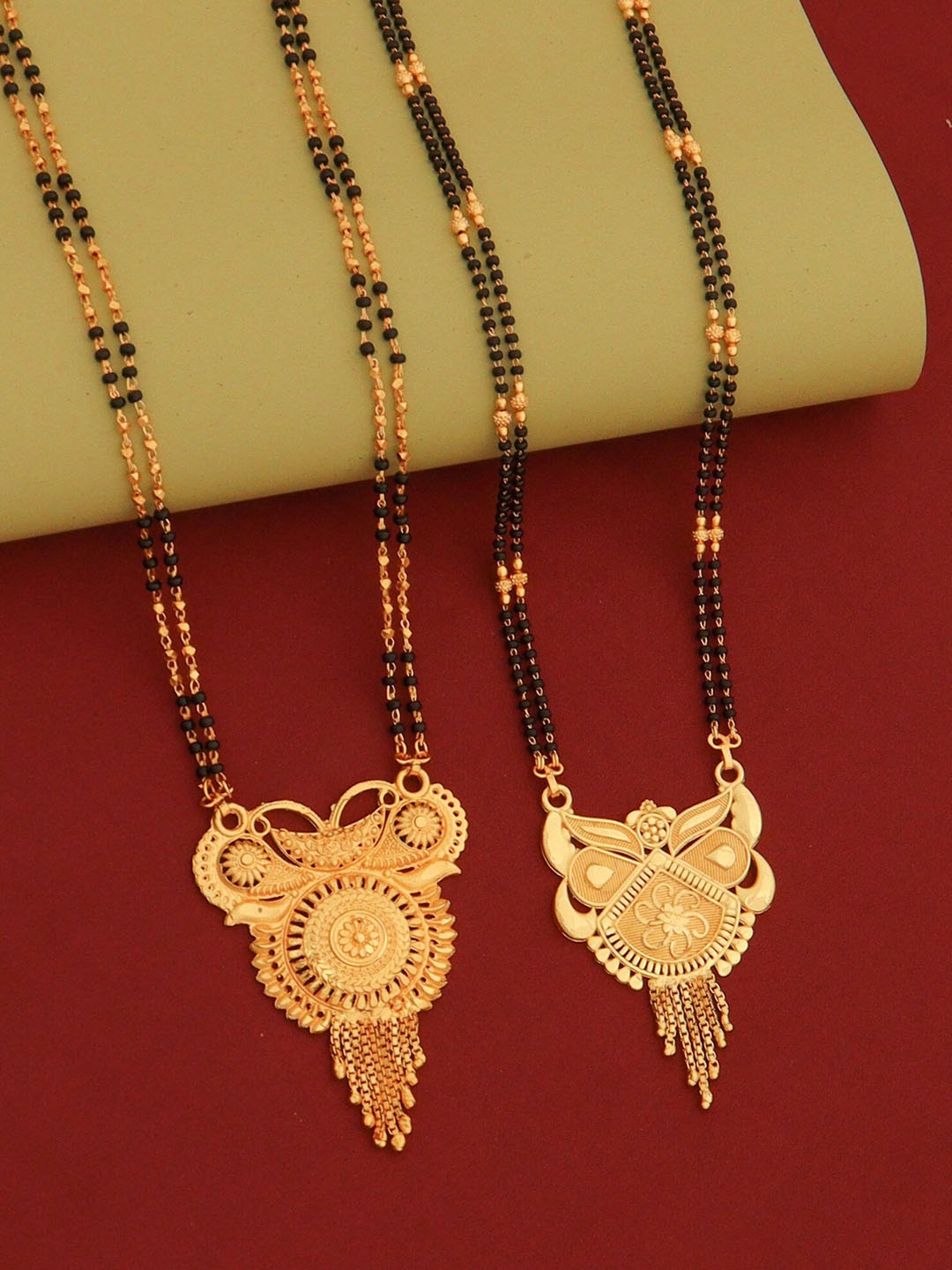 

Ramdev Art Fashion Jwellery Set Of 2 Gold-Plated Textured Mangalsutra