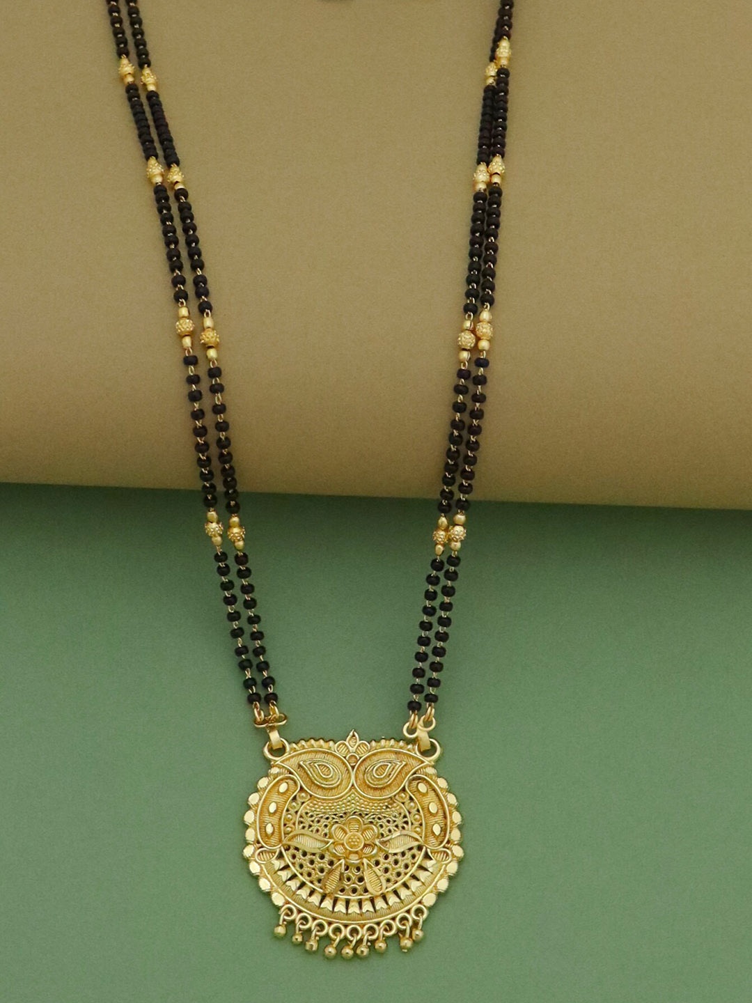 

Ramdev Art Fashion Jwellery Gold-Plated Textured Mangalsutra