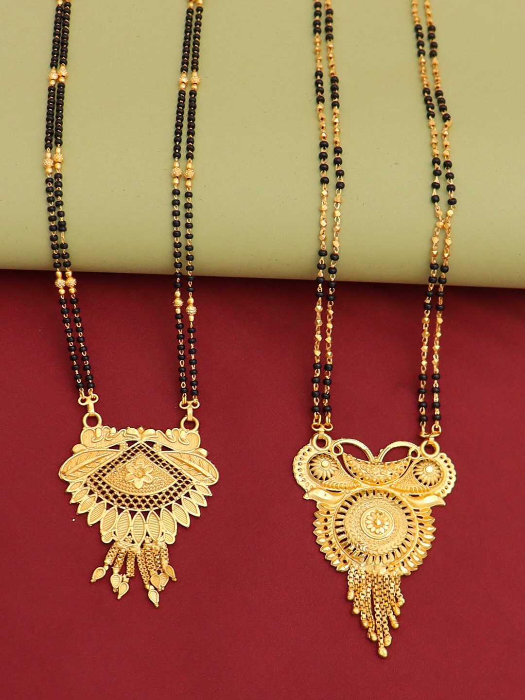 

Ramdev Art Fashion Jwellery Set Of 2 Gold-Plated Stone-Studded & Beaded Mangalsutra